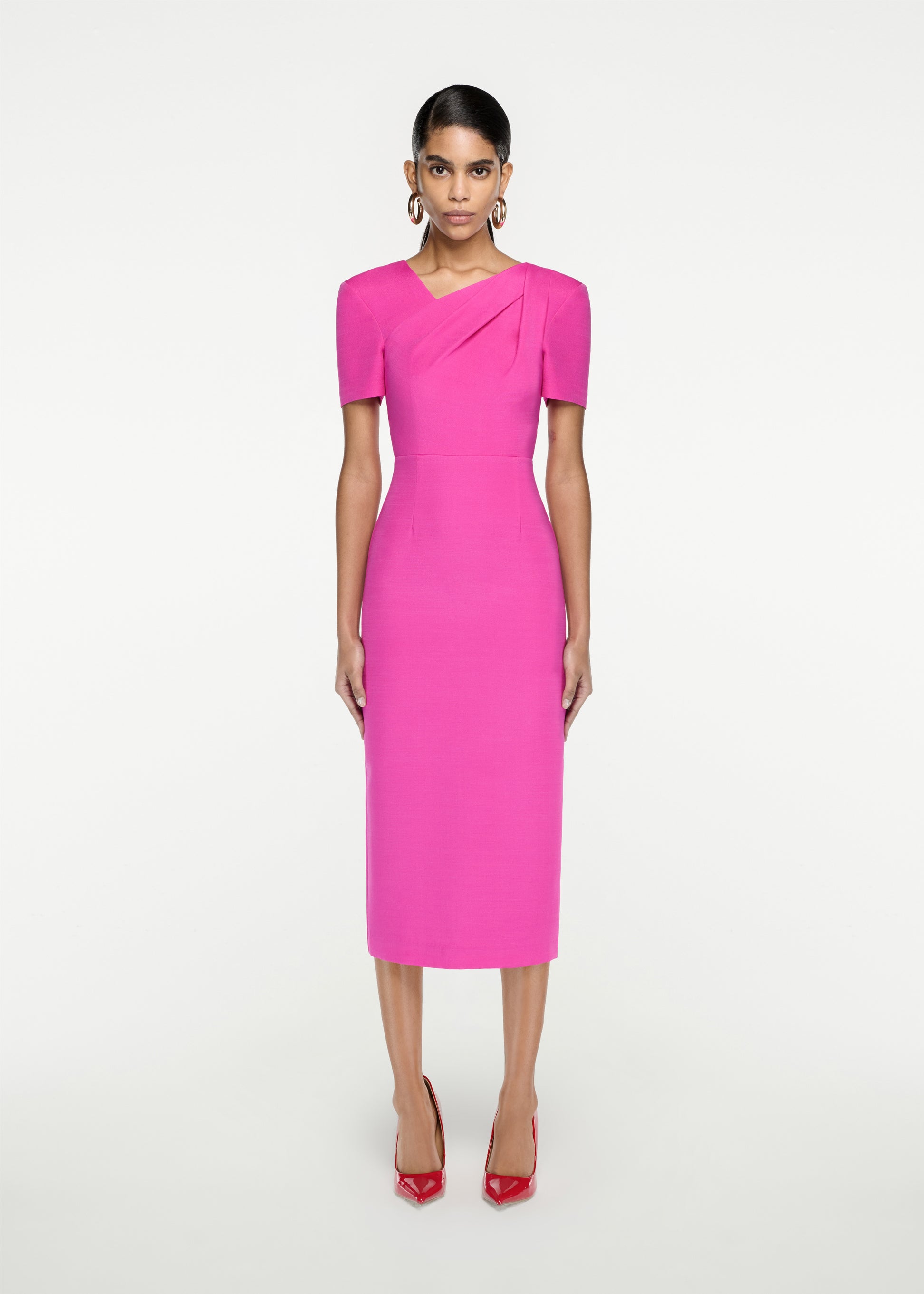 Woman wearing the Short Sleeve Silk Wool Midi Dress in Pink