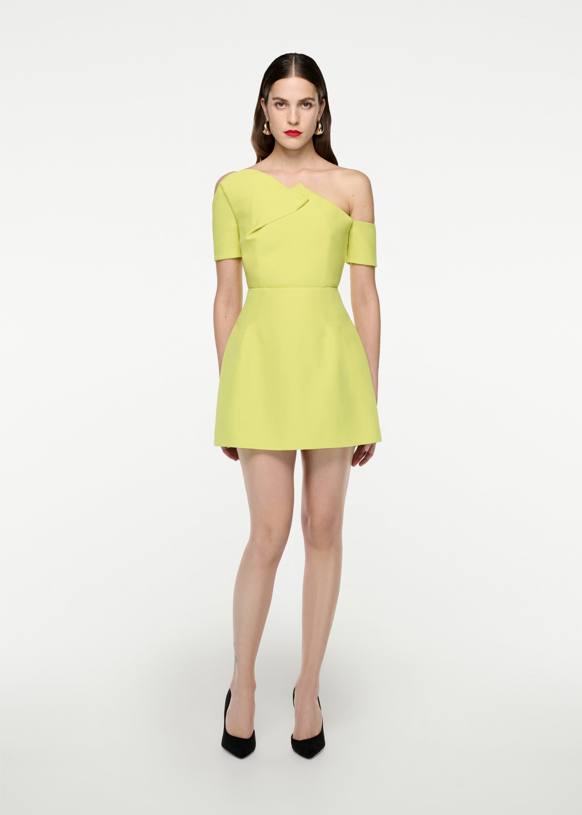 Woman wearing the Asymmetric Silk Wool  Mini Dress in Yellow