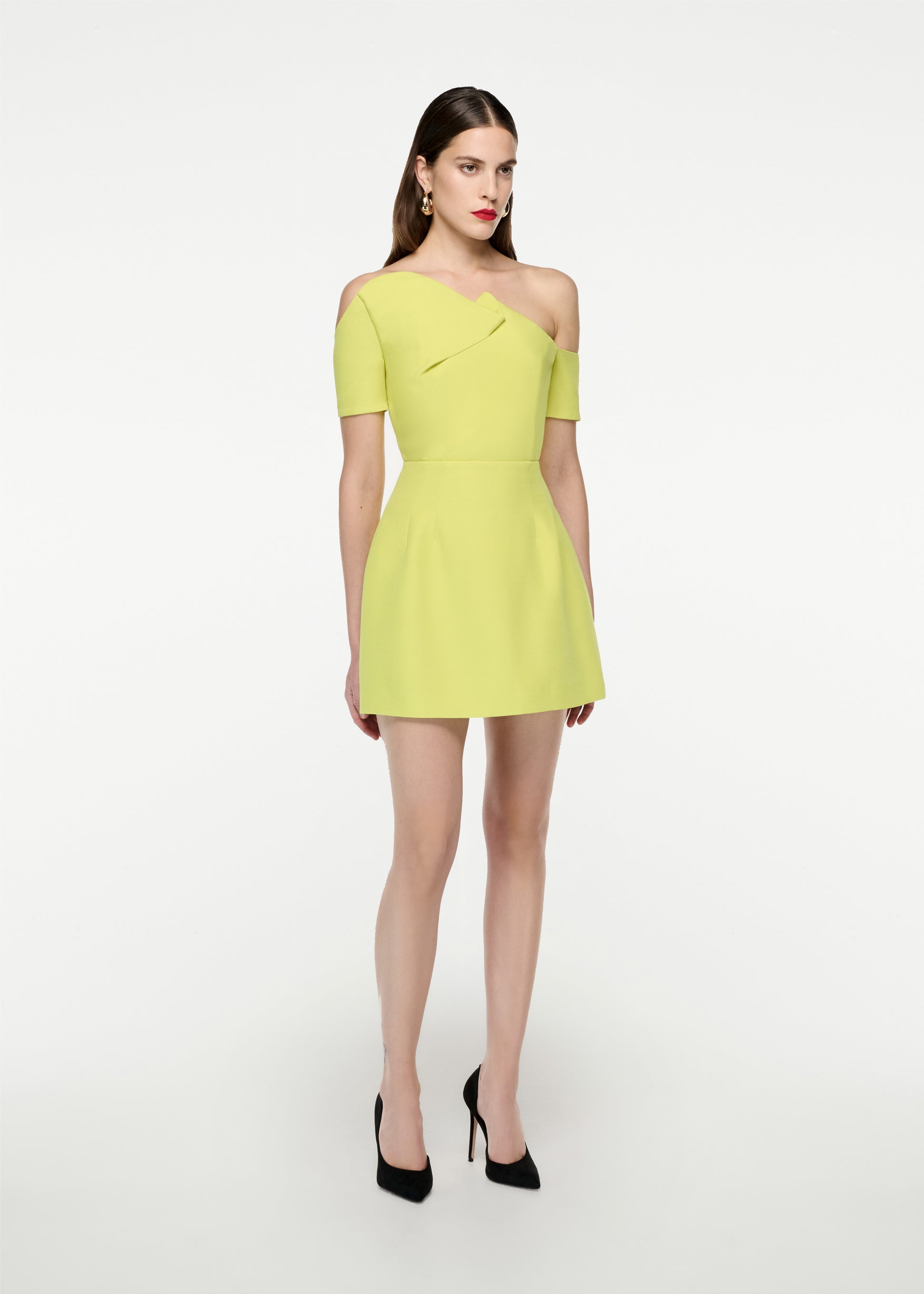 Woman wearing the Asymmetric Silk Wool  Mini Dress in Yellow
