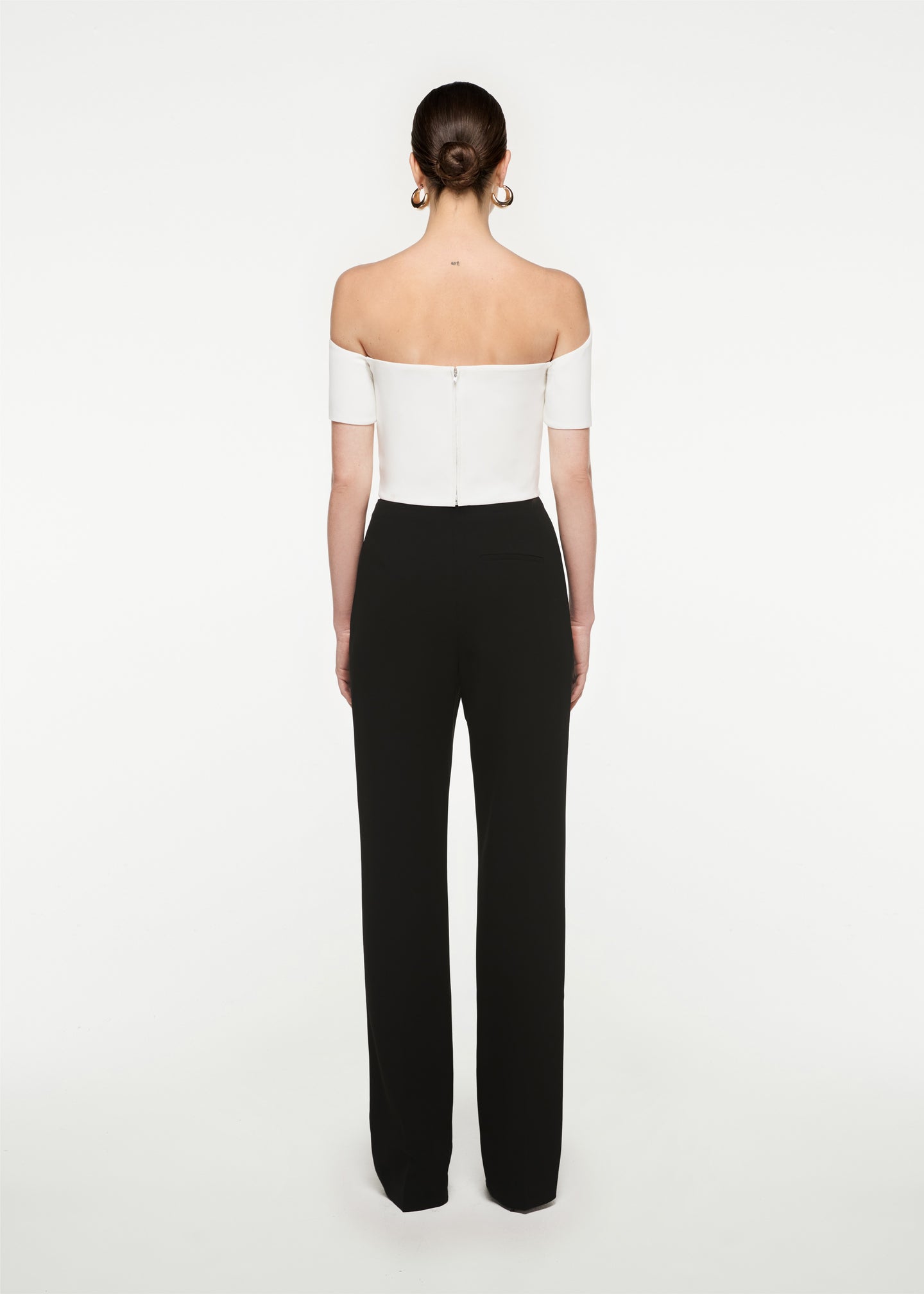 The back of a woman wearing the Asymmetric Stretch Cady Top White in White