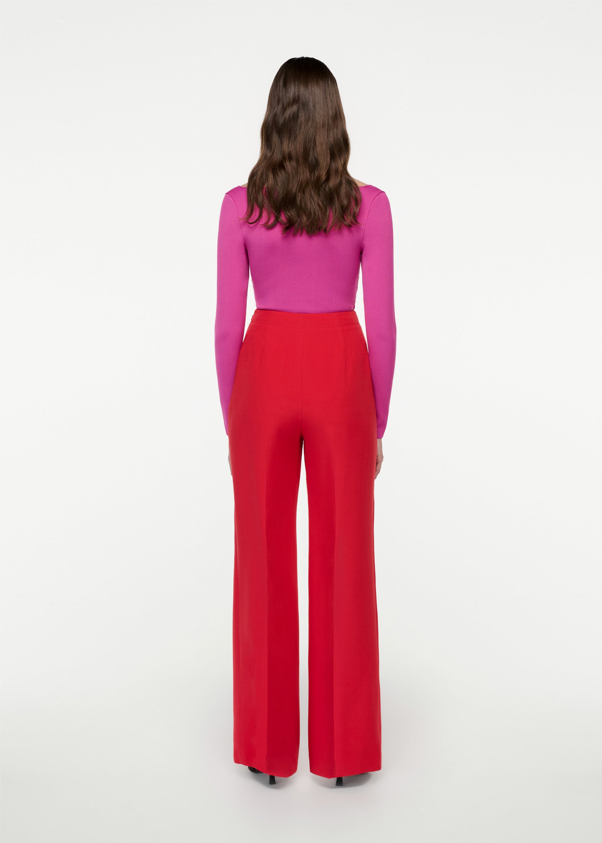 The back of a woman wearing the Wide Leg Silk Wool Trouser in Red
