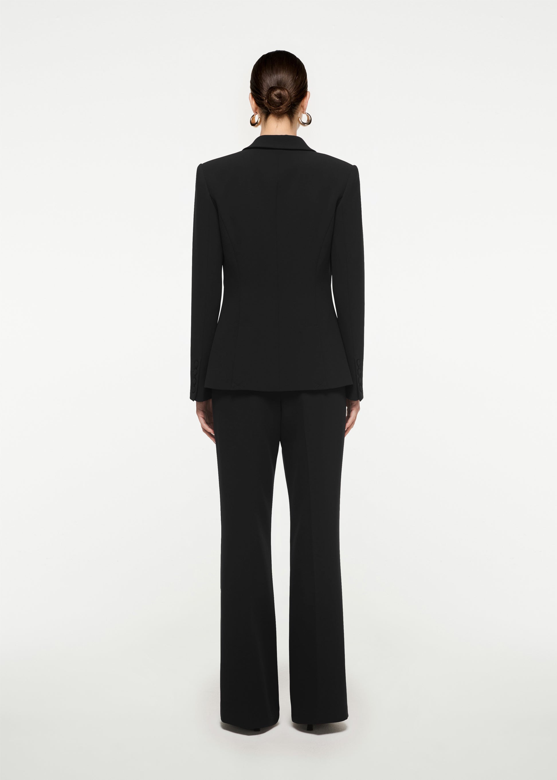 The back of a woman wearing the Single Breasted Stretch Cady Blazer in Black