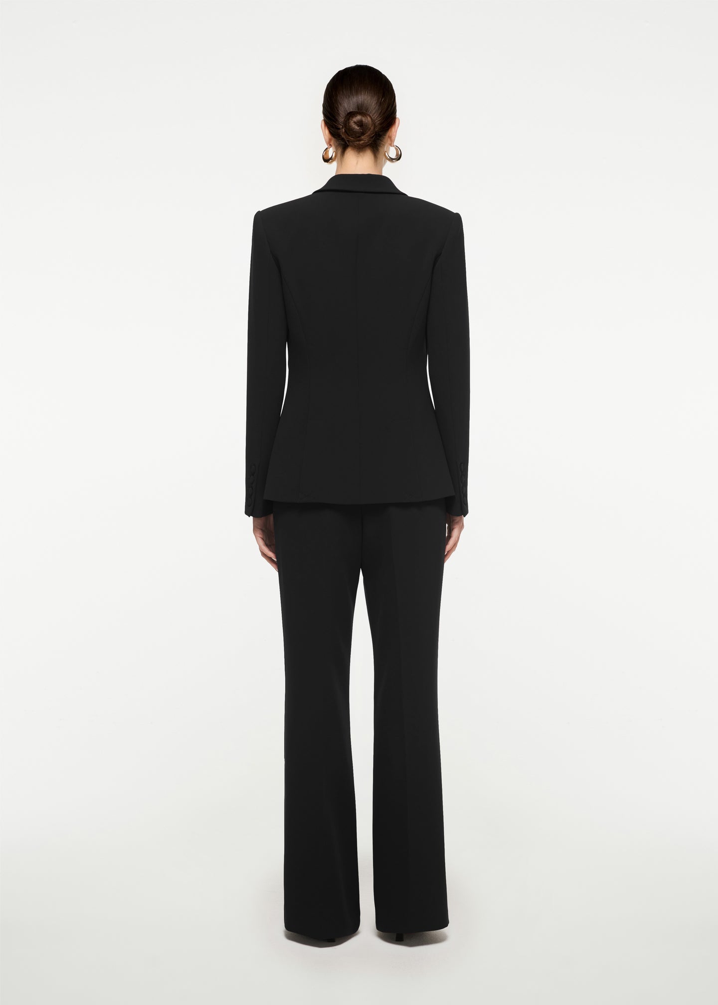 The back of a woman wearing the Wide Leg Stretch Cady Trouser in White