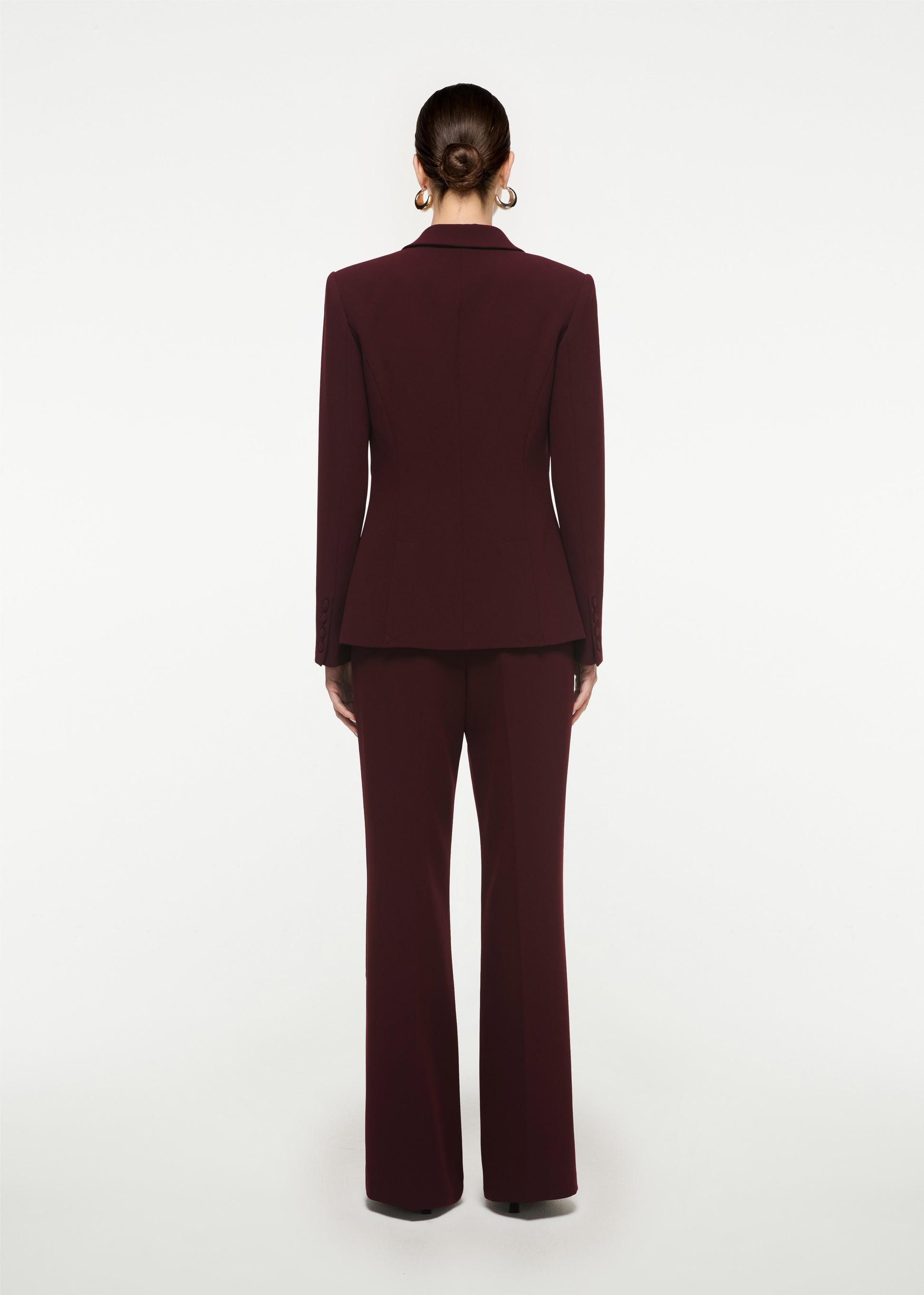 The back of a woman wearing the Single Breasted Stretch Cady Blazer in Maroon
