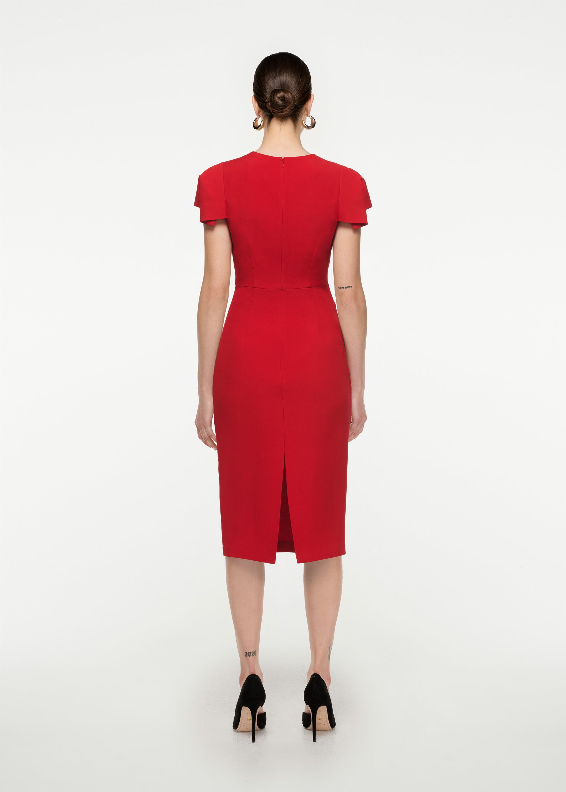 The back of a woman wearing the Cap Sleeve Silk Wool Midi Dress in Red