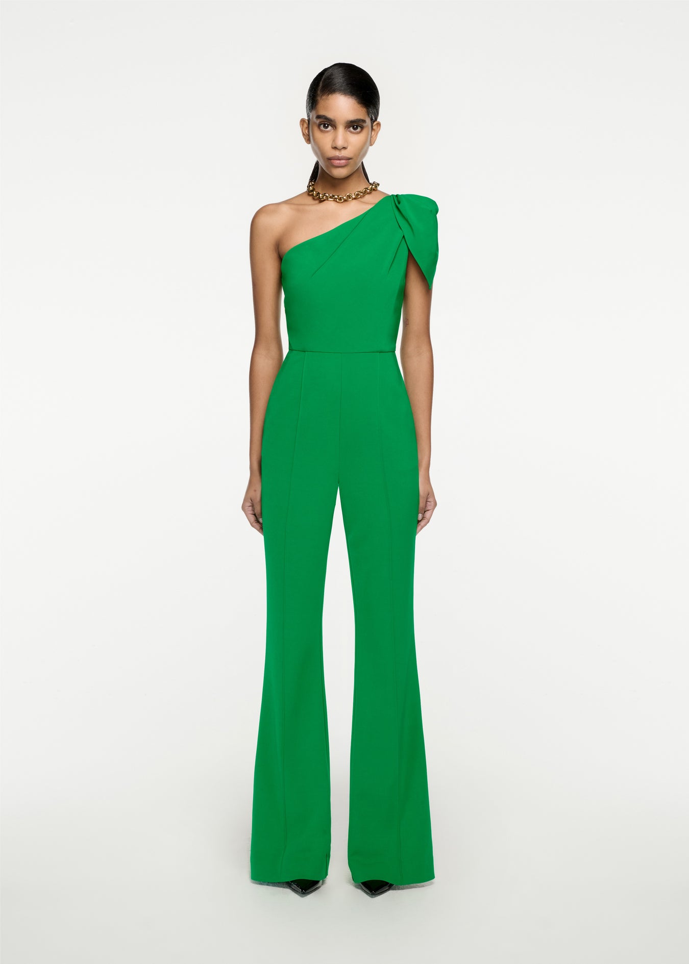 Woman wearing the Asymmetric Stretch Cady Jumpsuit in Green