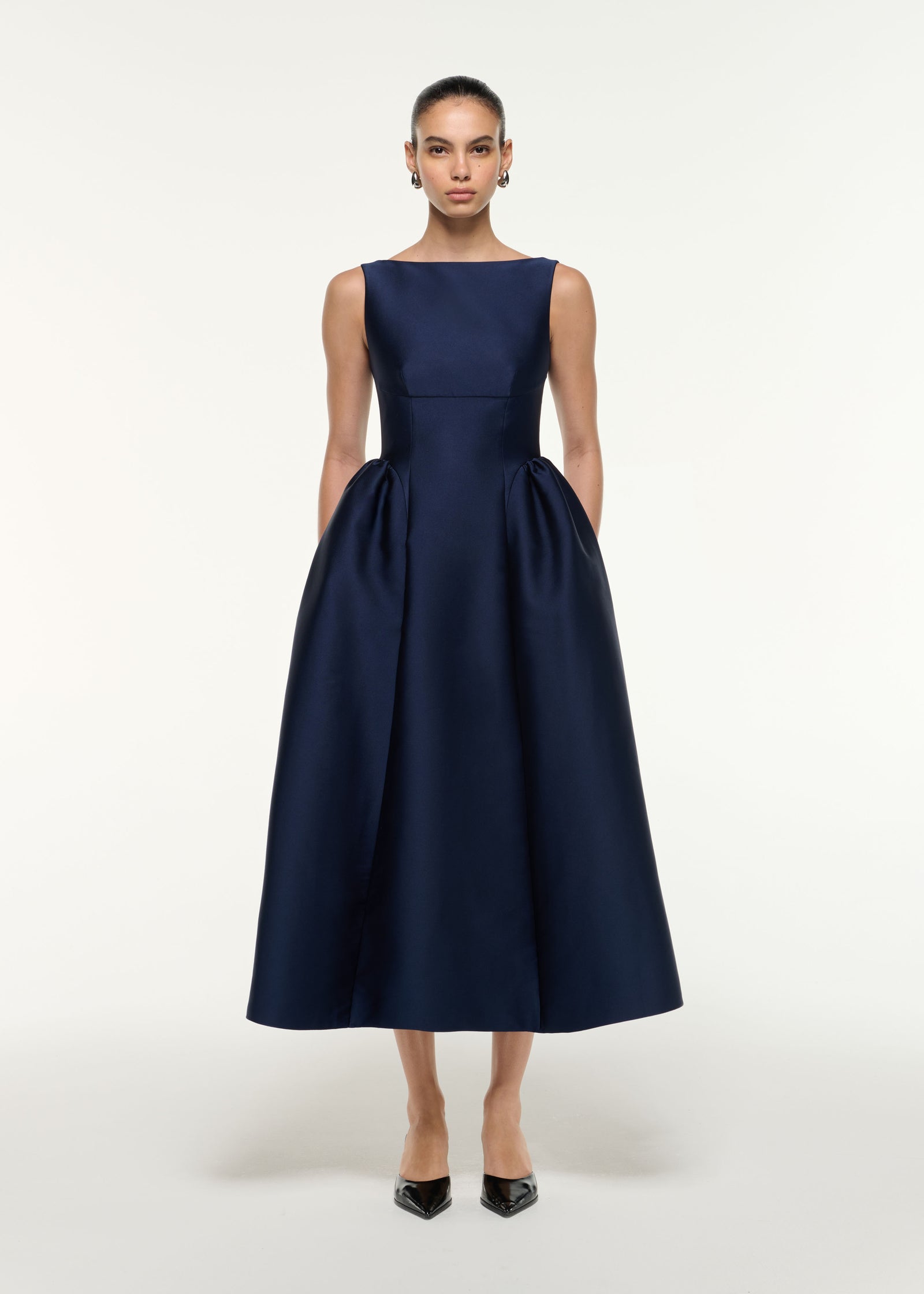 Front view of a model wearing the Taffeta Midi Dress in Navy