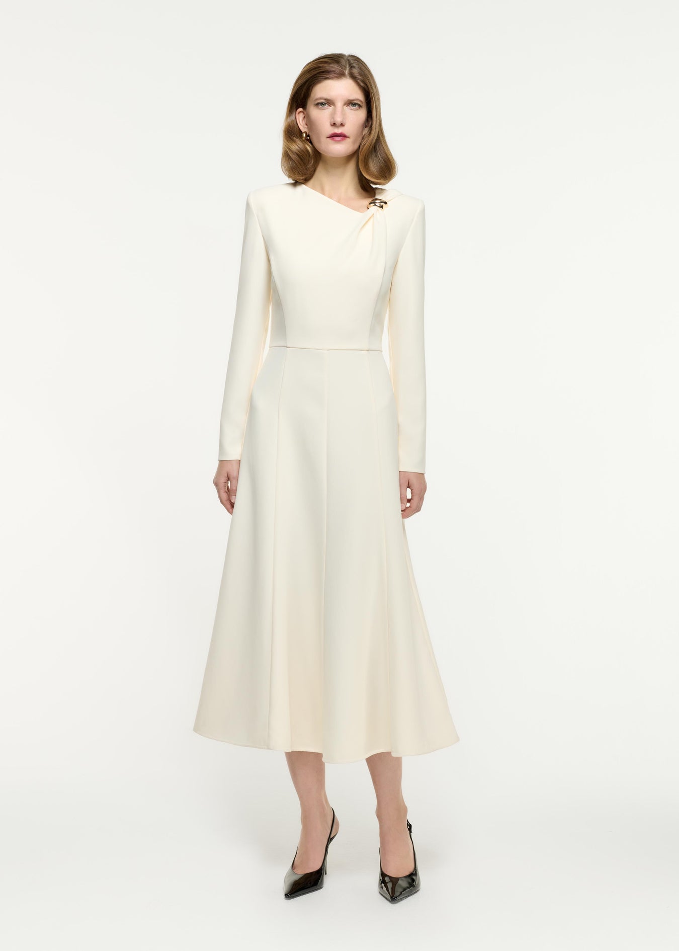 Front view of a model wearing the Long Sleeve Buckle Heavy cady Midi Dress in Cream
