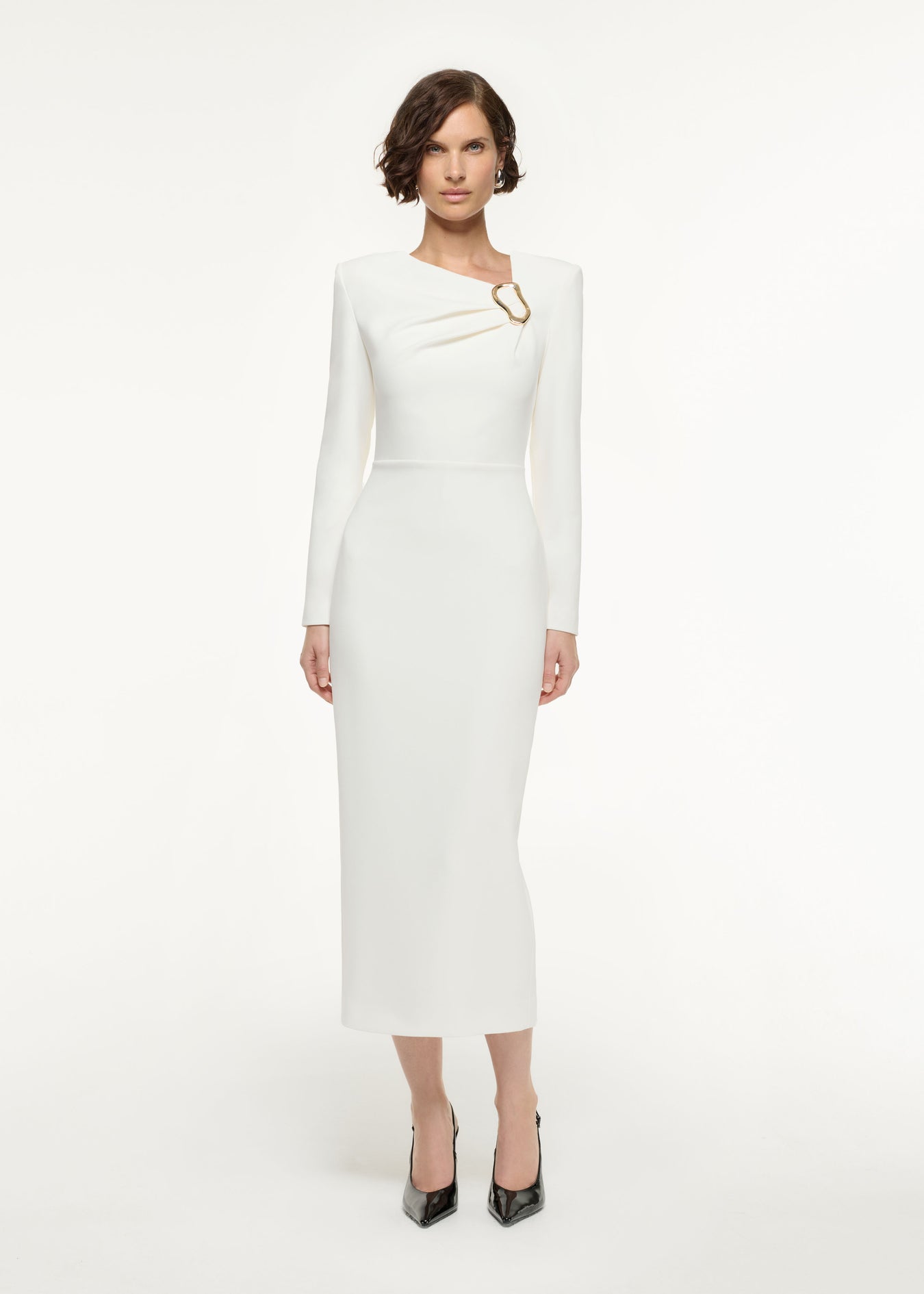 Front view of a model wearing the Long Sleeve Buckle Crepe Midi Dress in Cream