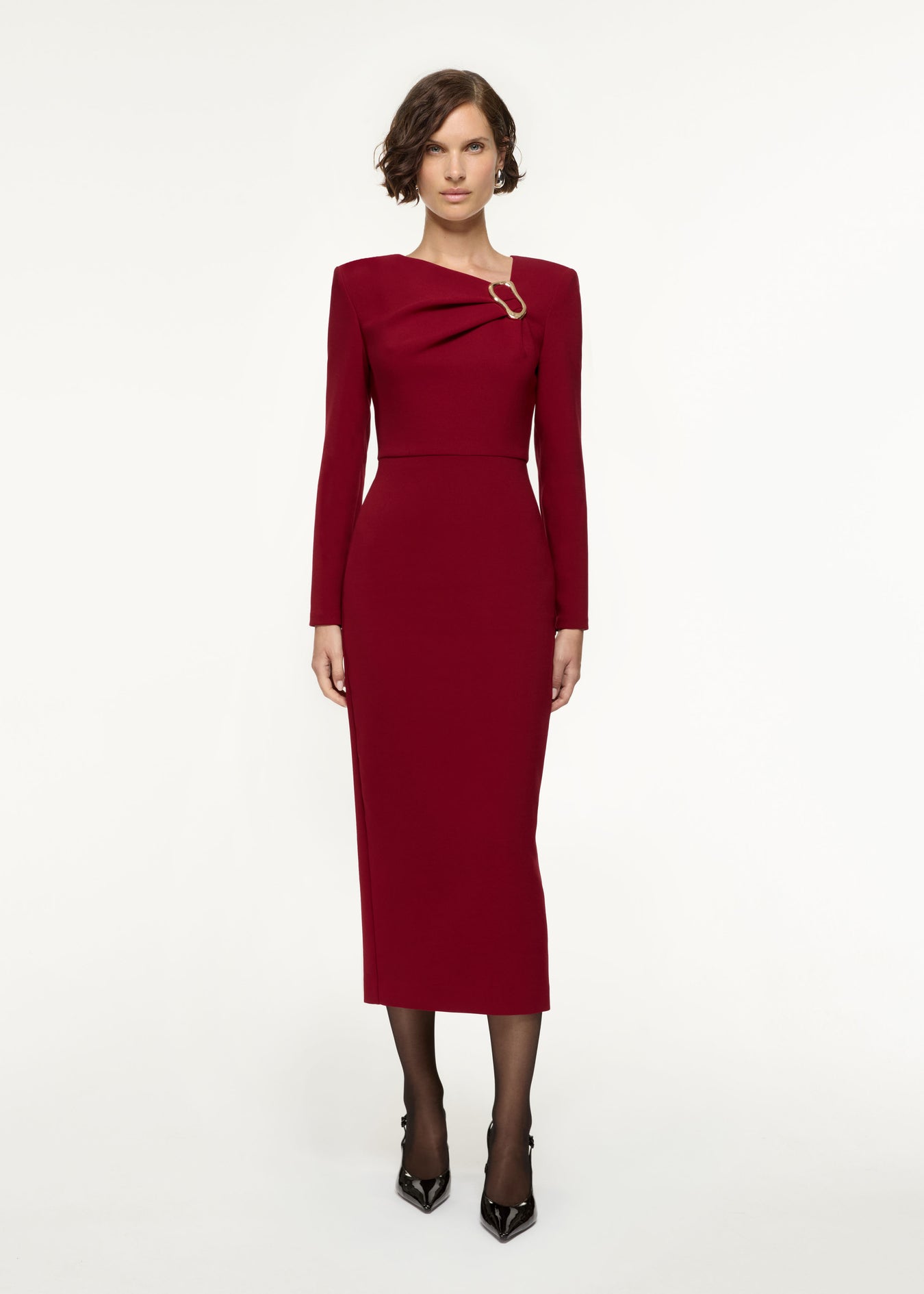 Front view of a model wearing the Long Sleeve Buckle Crepe Midi Dress in Red