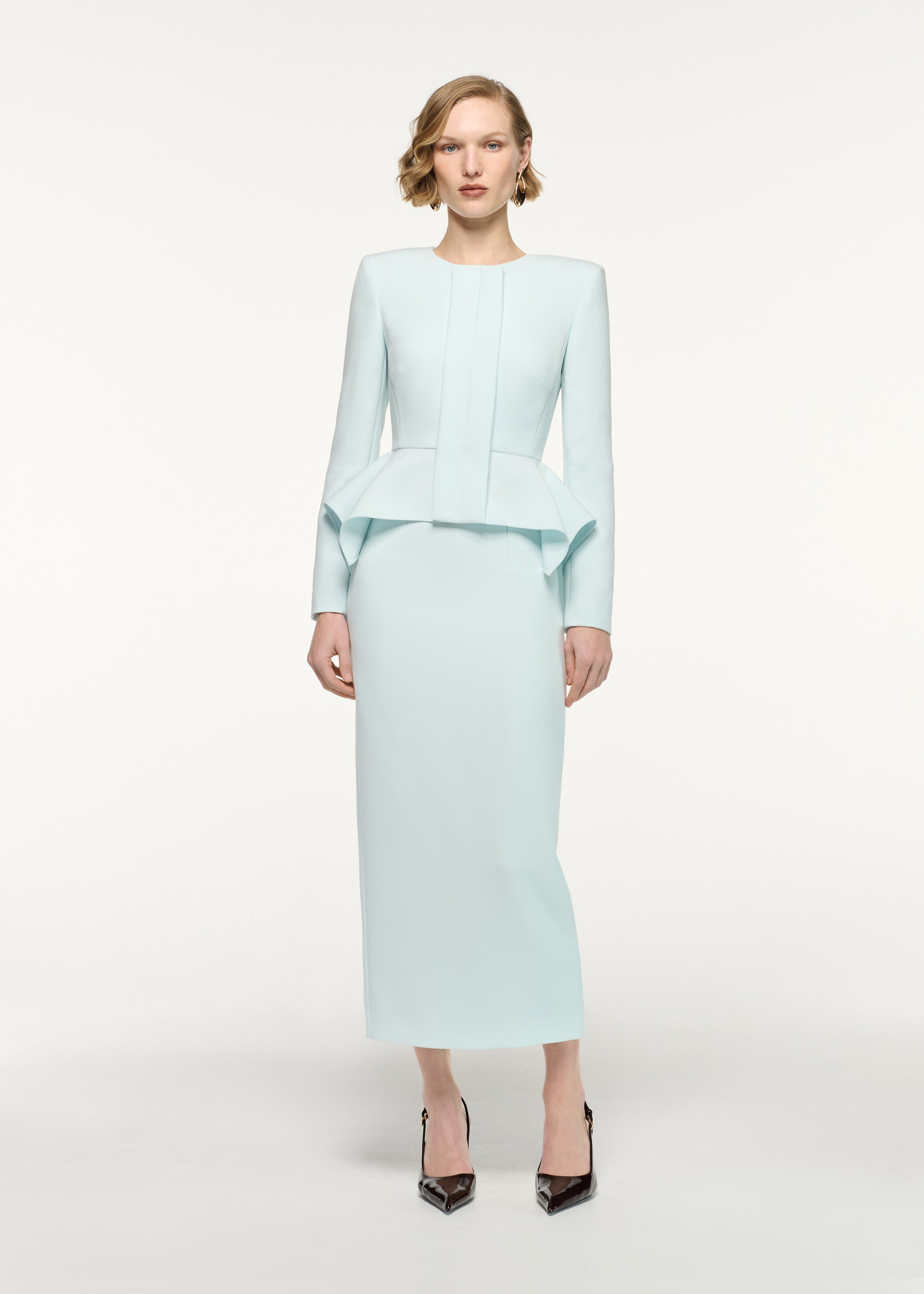 Front view of a model wearing the Crepe Midi Skirt in Aqua 