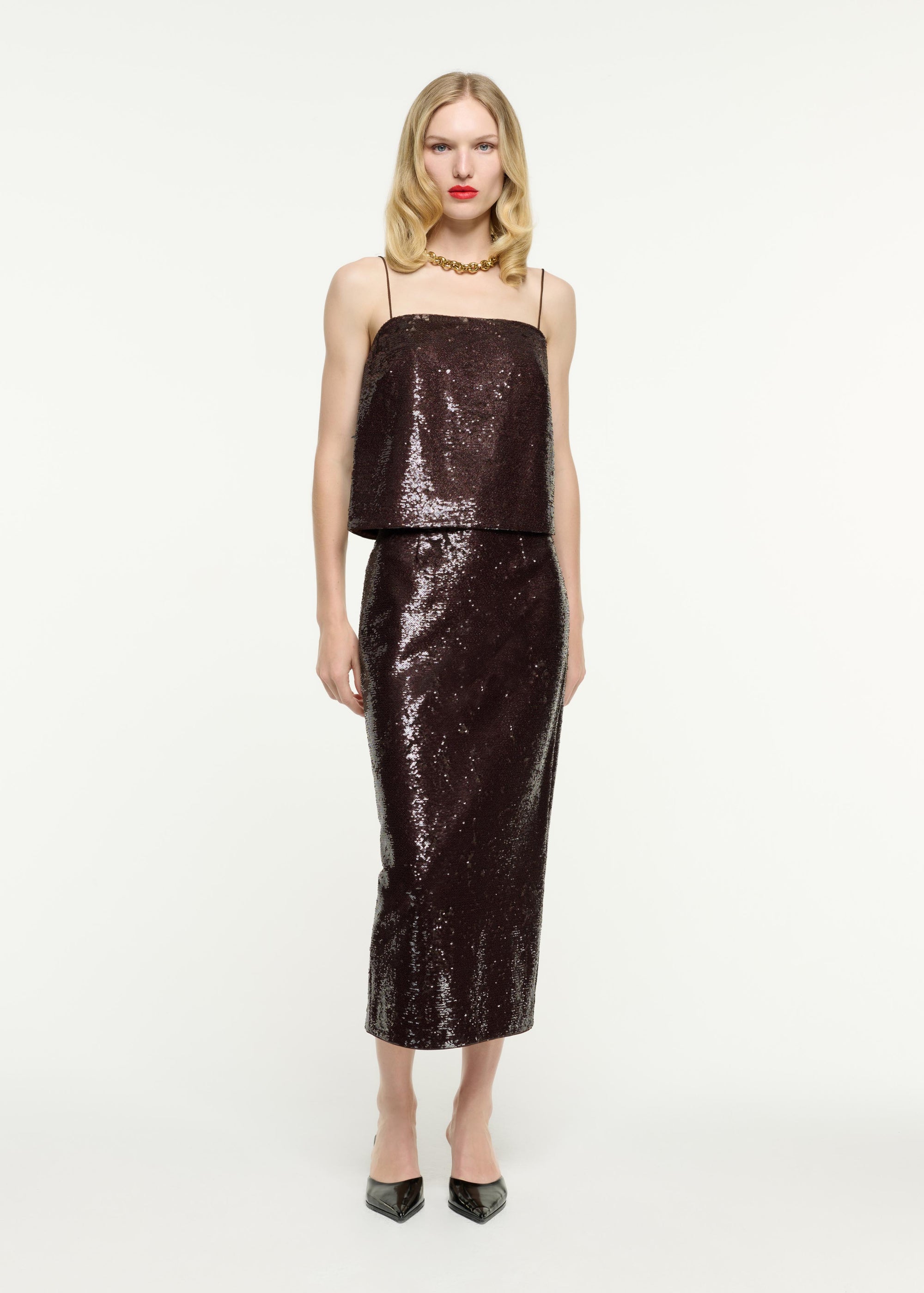 Front view of a model wearing the Sequin Midi Skirt in Brown