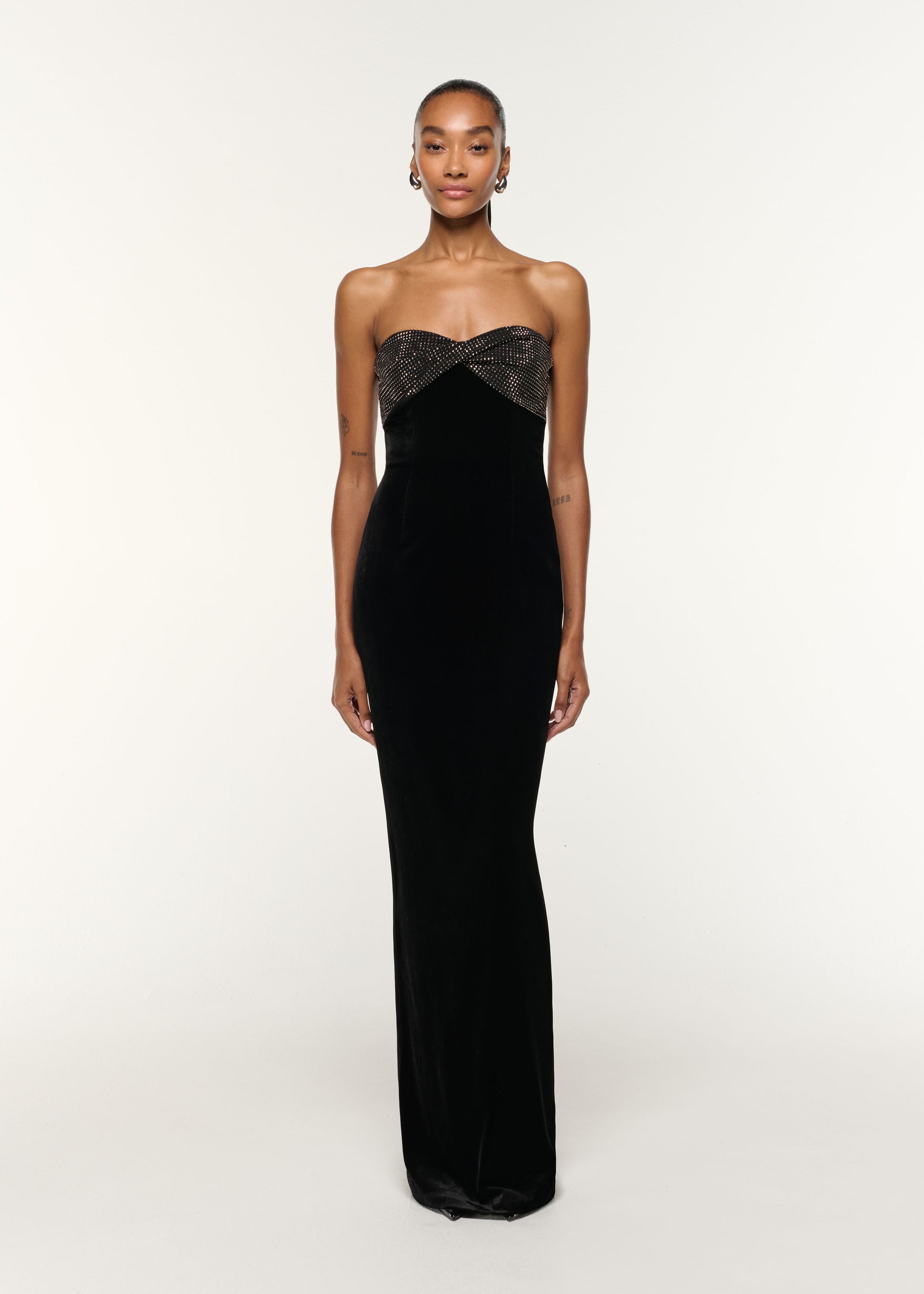Front view of a model wearing the Diamante Twist Drape Velvet Column Gown in Black