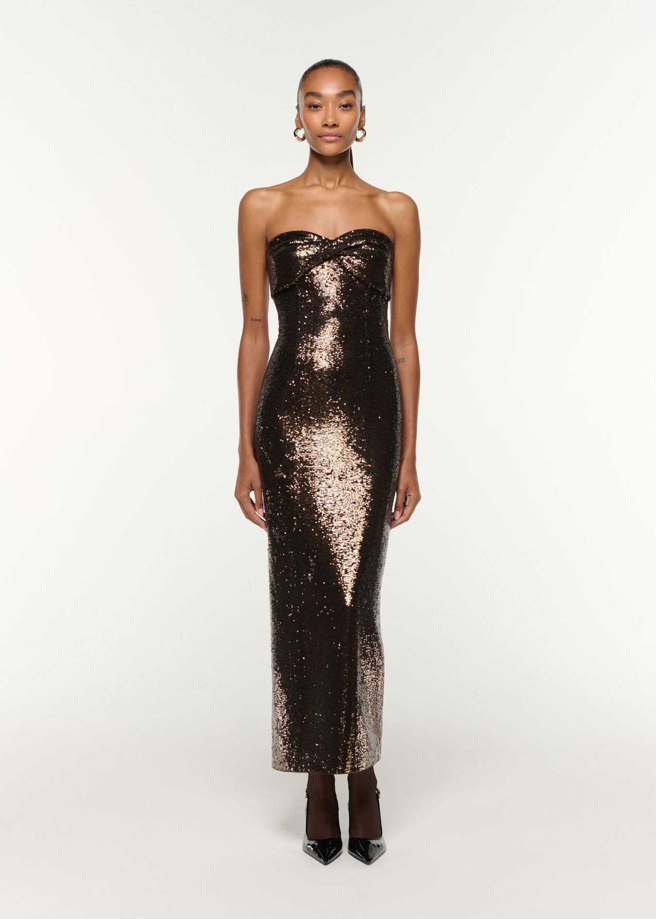 Front view of a model wearing the Twist Drape Sequin Dress in Bronze