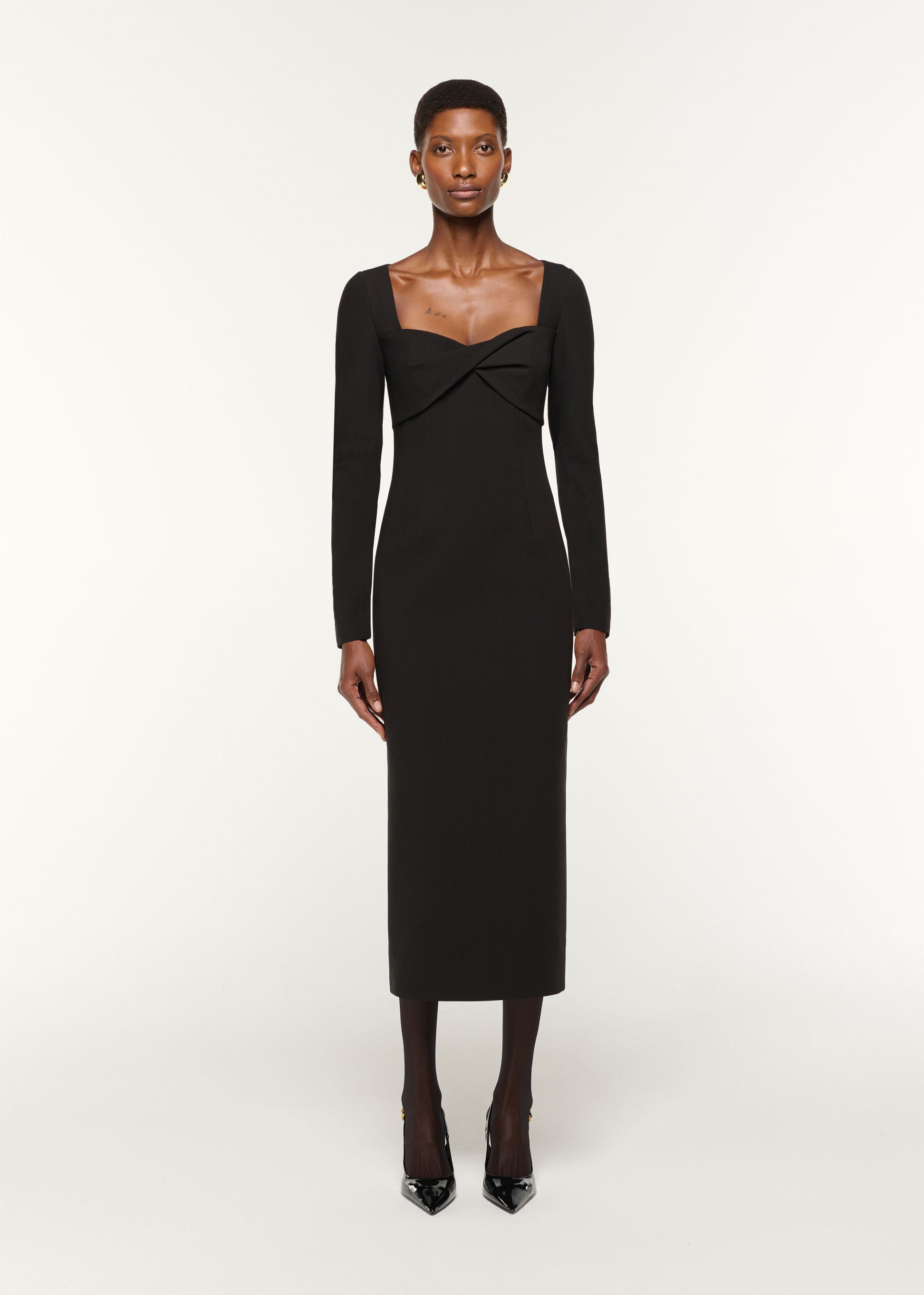 Front view of a model wearing the Twist Drape Stretch Crepe Dress in Black