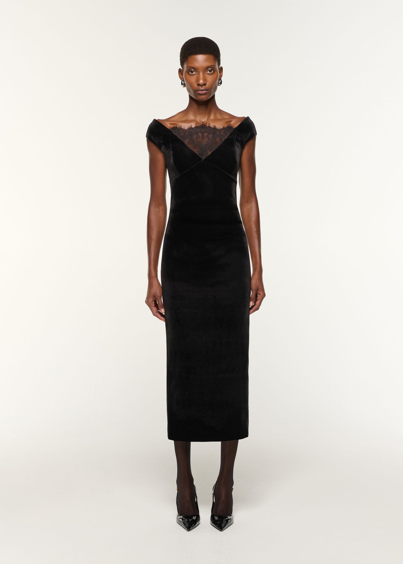 Front view of a model wearing the Lace Insert Scuba Velvet Dress in Black
