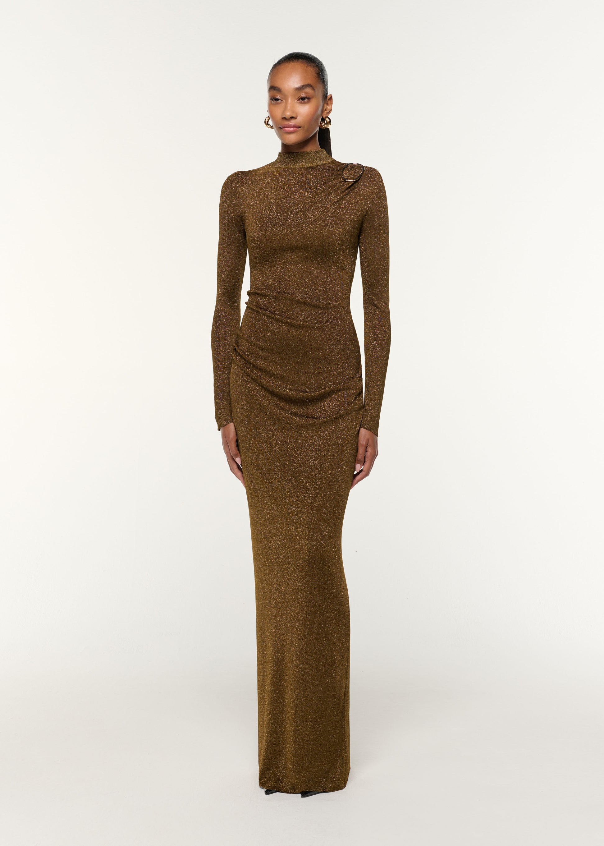 Side view of a model wearing the Lurex Knit Drape & Metal Trim Dress in Khaki
