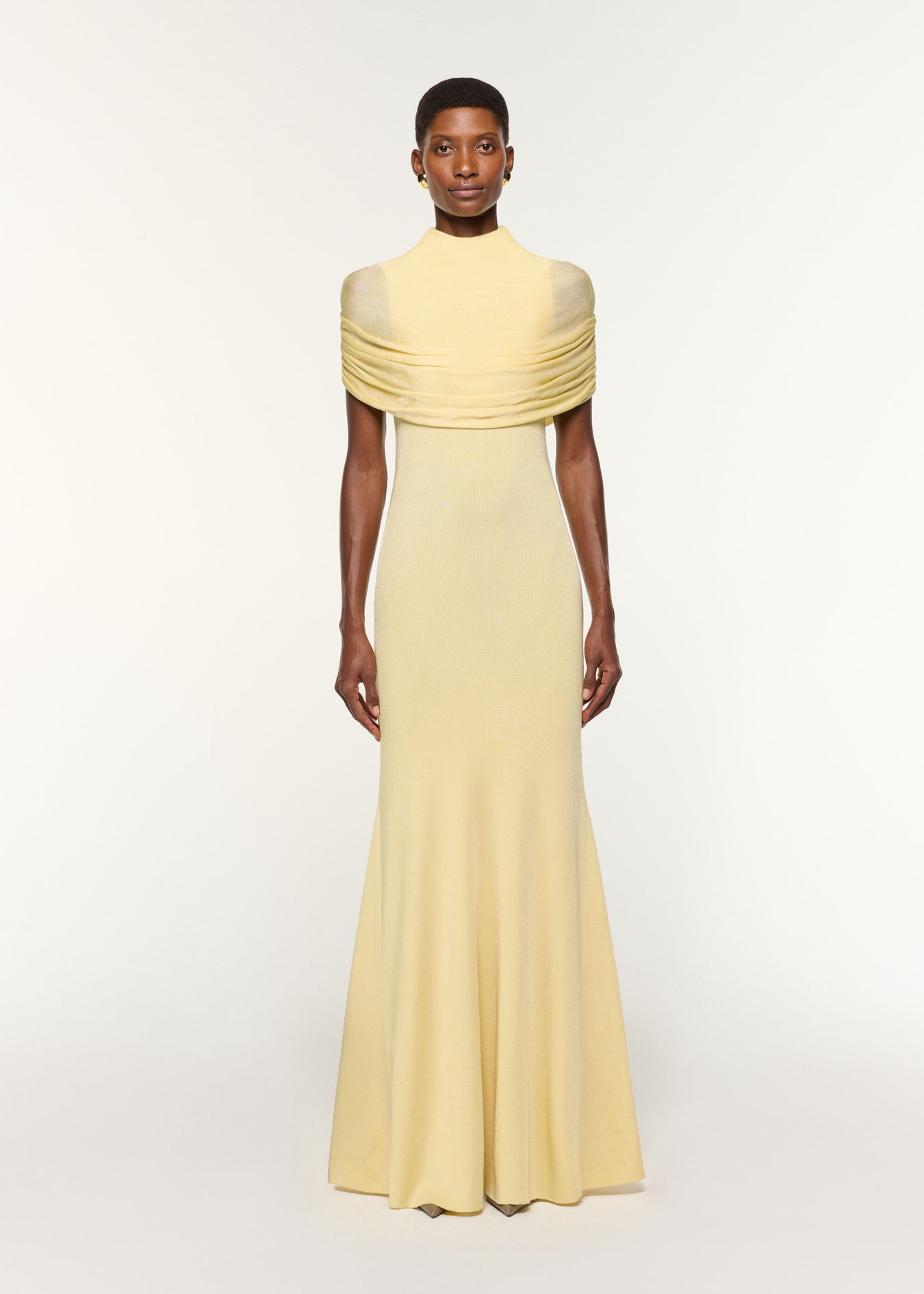 Front view of a model wearing the Draped Shawl Viscose Knit Dress in Yellow
