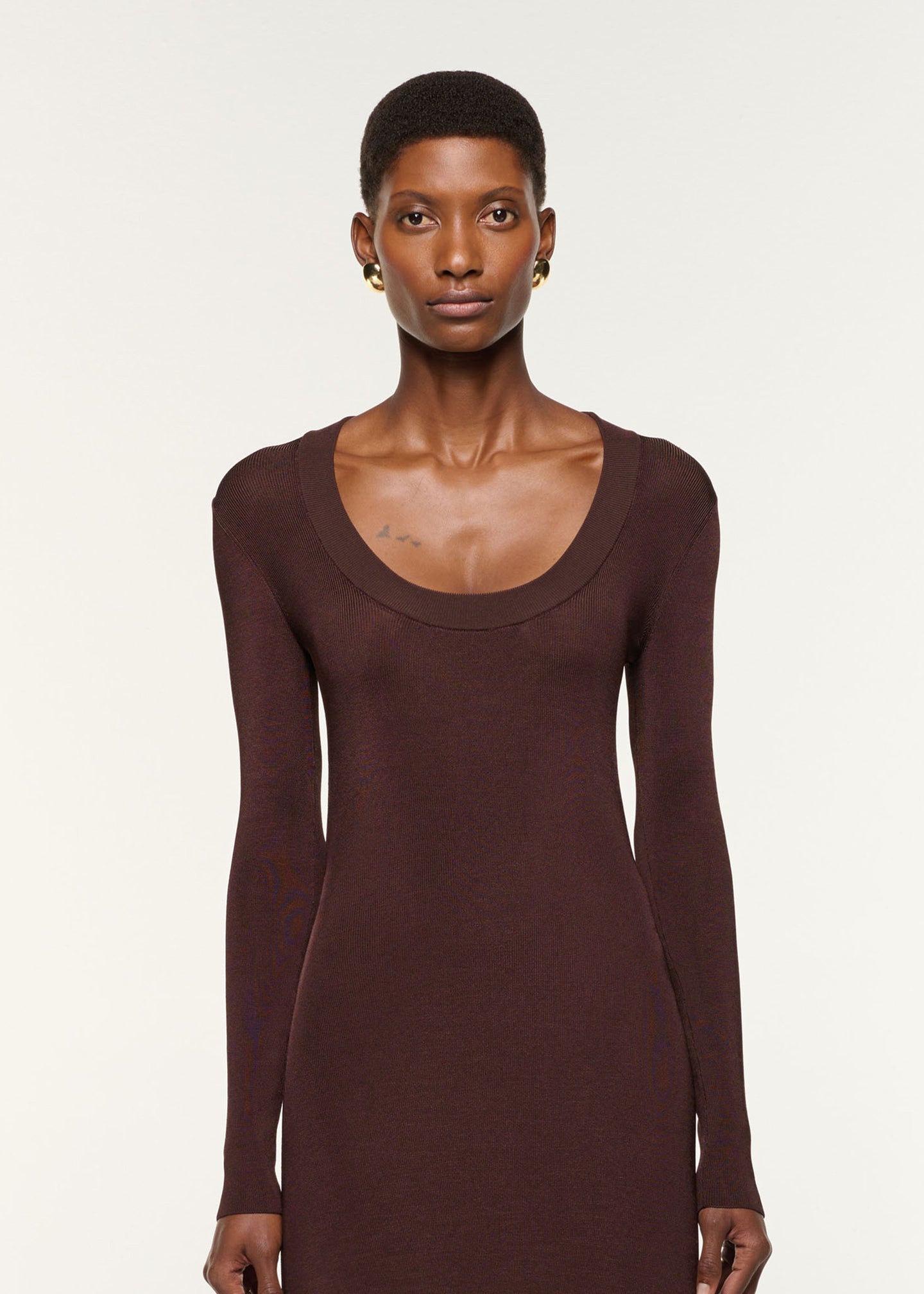 Close up of a model wearing the Scoop Neck Viscose Knit Dress in Brown