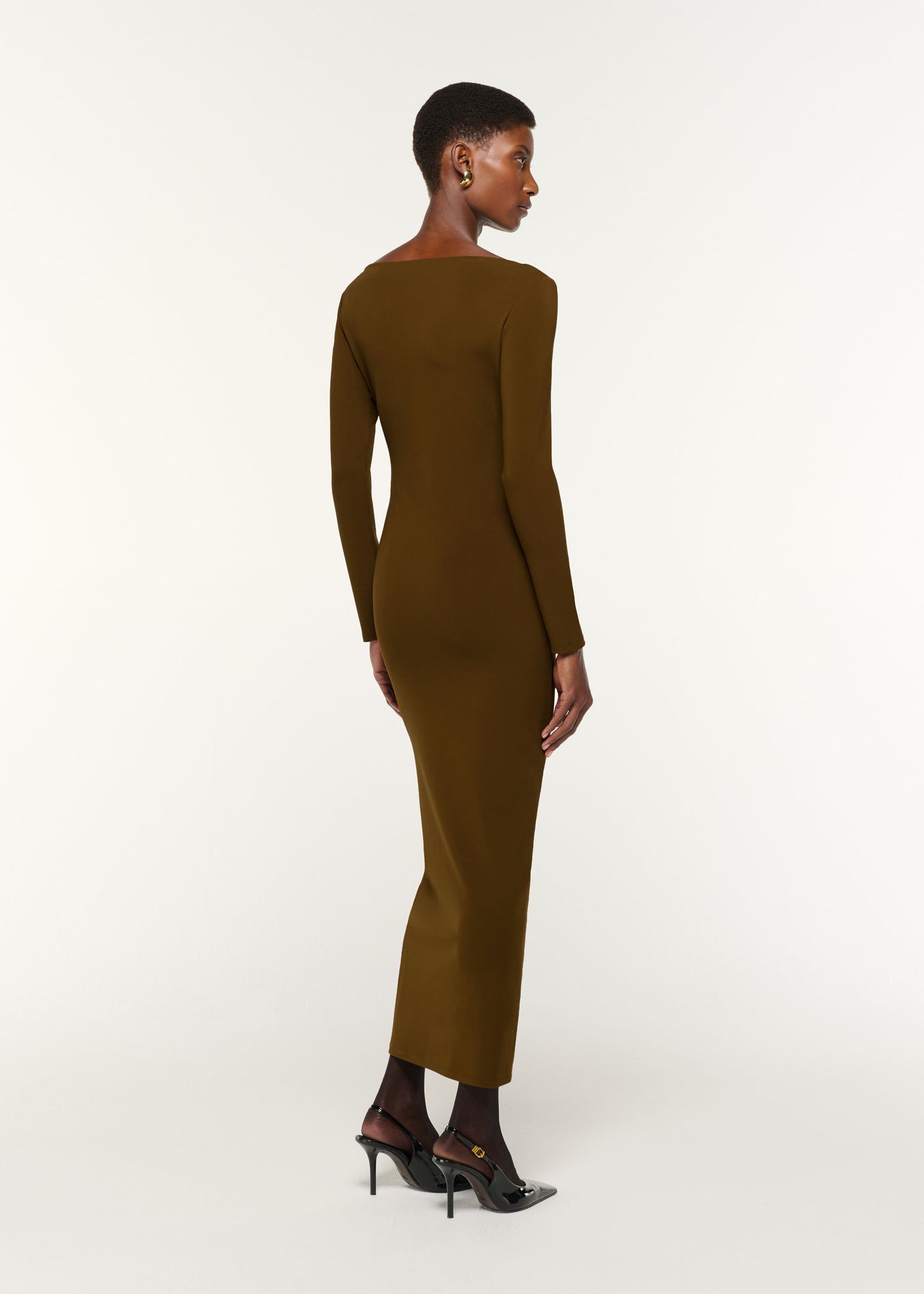 Back view of a model wearing the Jersey Twist Drape & Metal Trim Dress in Brown