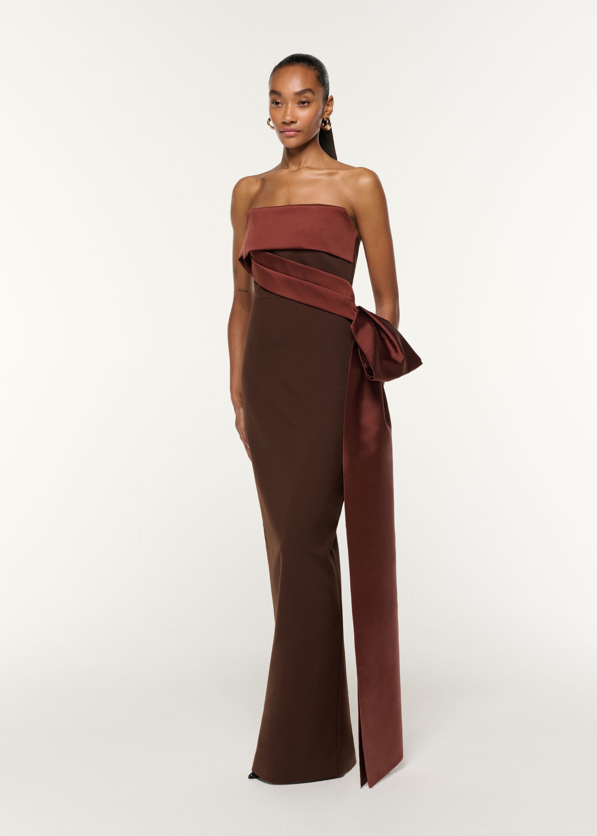 Side view of a model wearing the Contrast Drape Taffeta And Stretch Crepe Gown in Brown