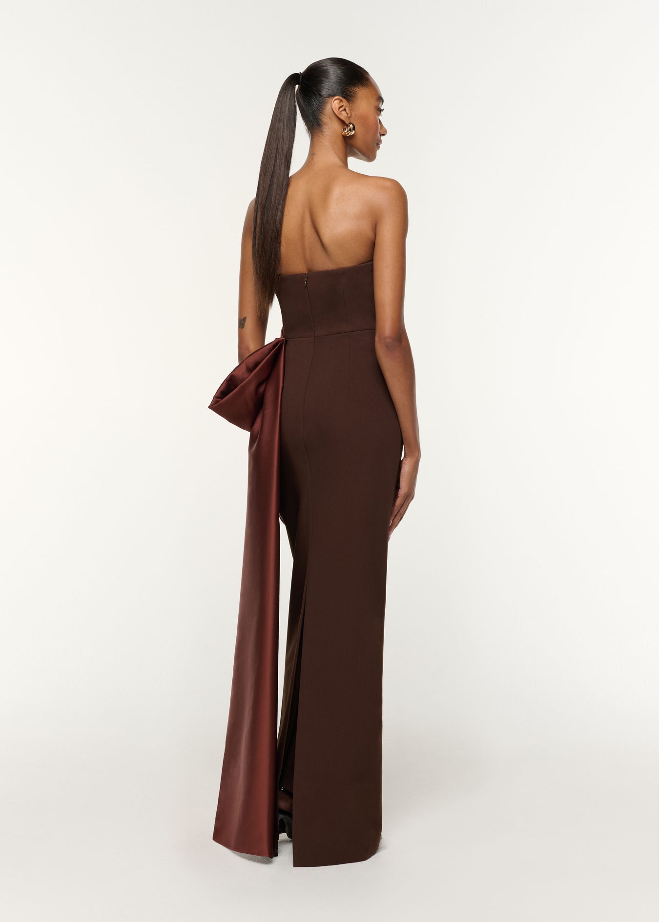 Back view of a model wearing the Contrast Drape Taffeta And Stretch Crepe Gown in Brown