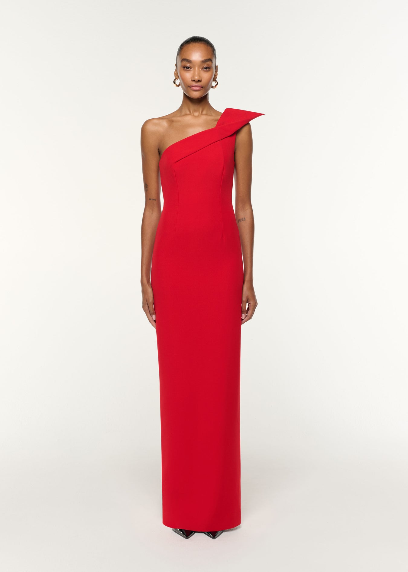 Front view of a model wearing the Structured Drape One Shoulder Crepe Gown in Red
