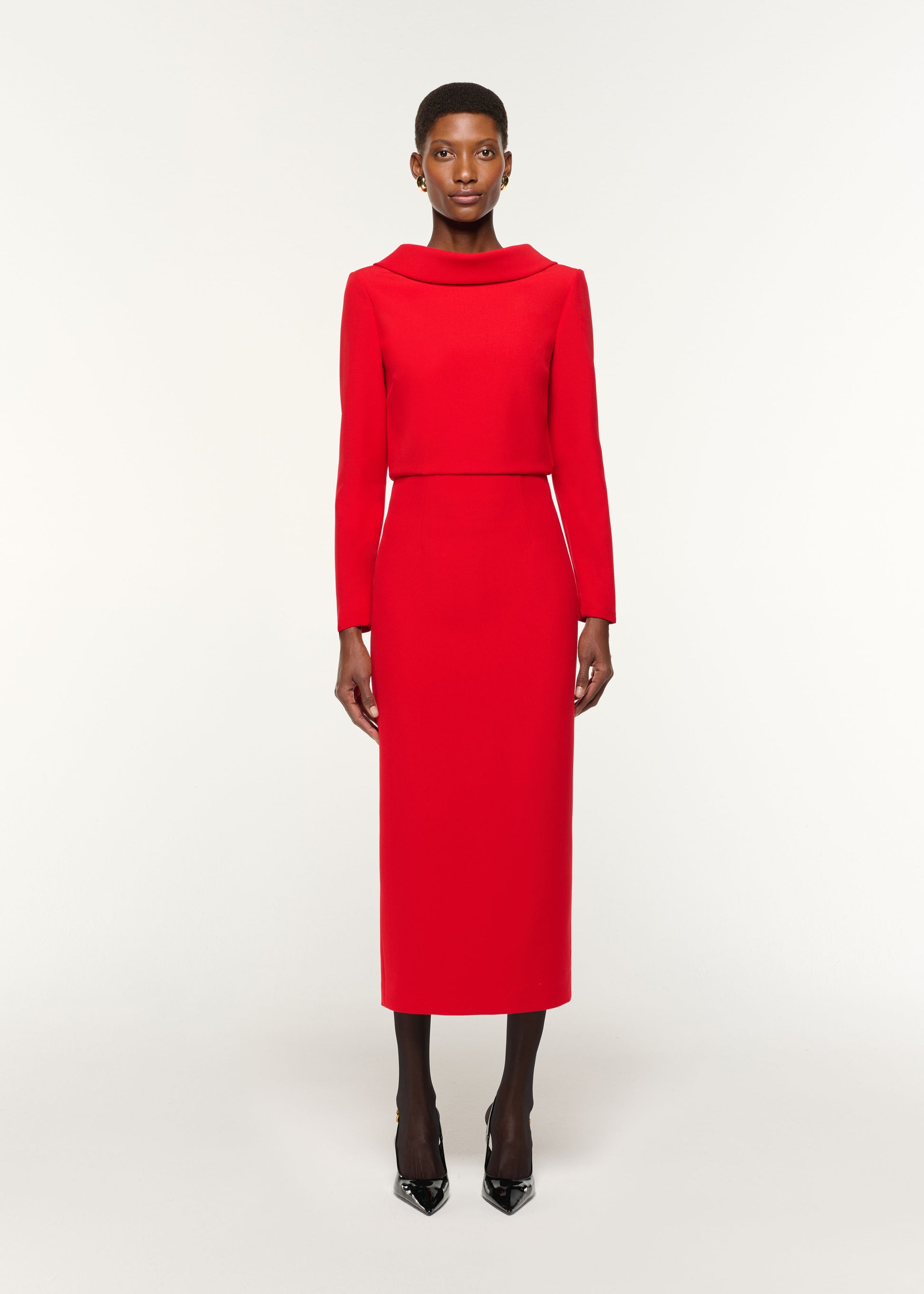 Front view of a model wearing the Crepe Column Skirt in Red
