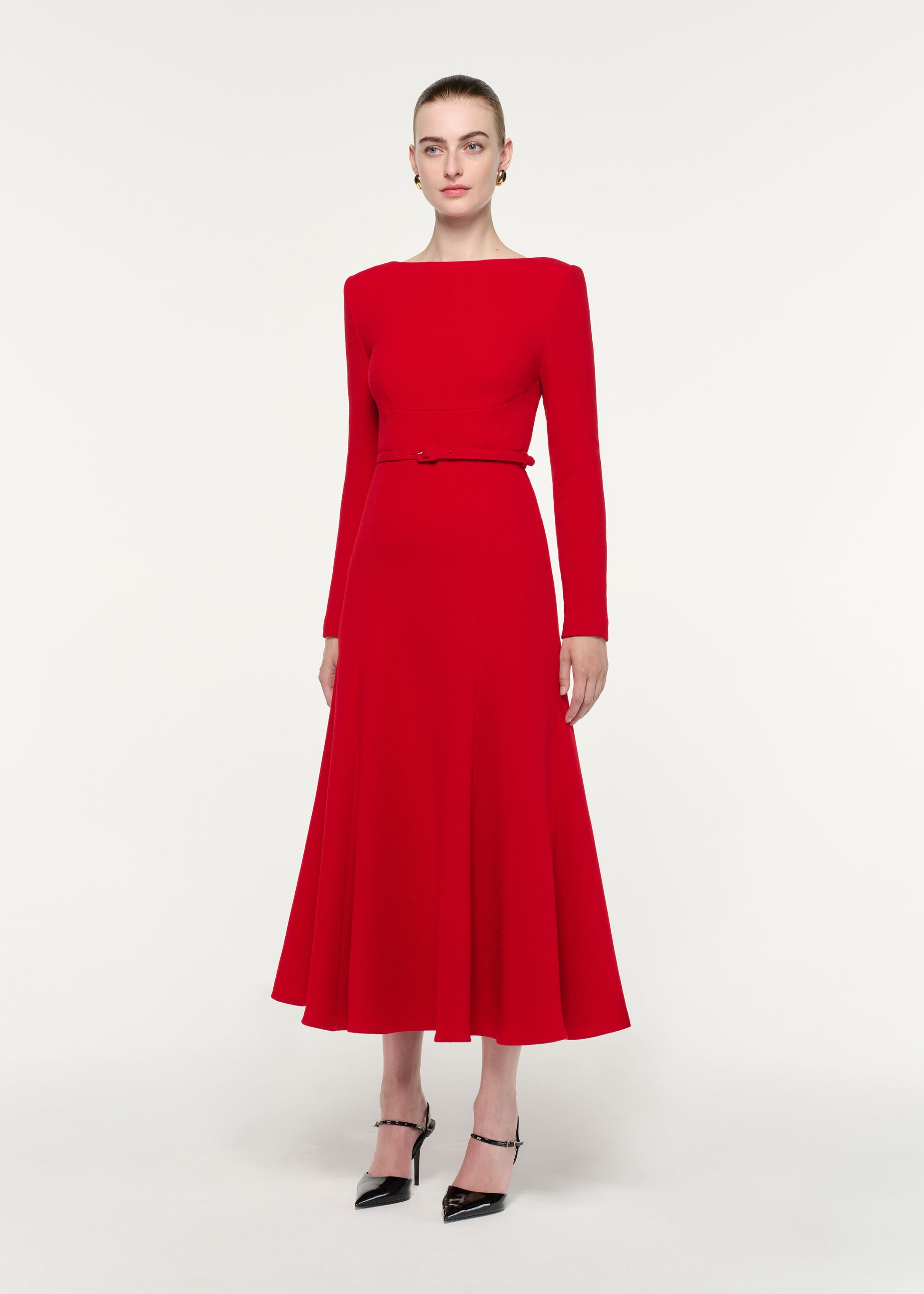 Side view of a model wearing the Boat Neck Wool Crepe Dress