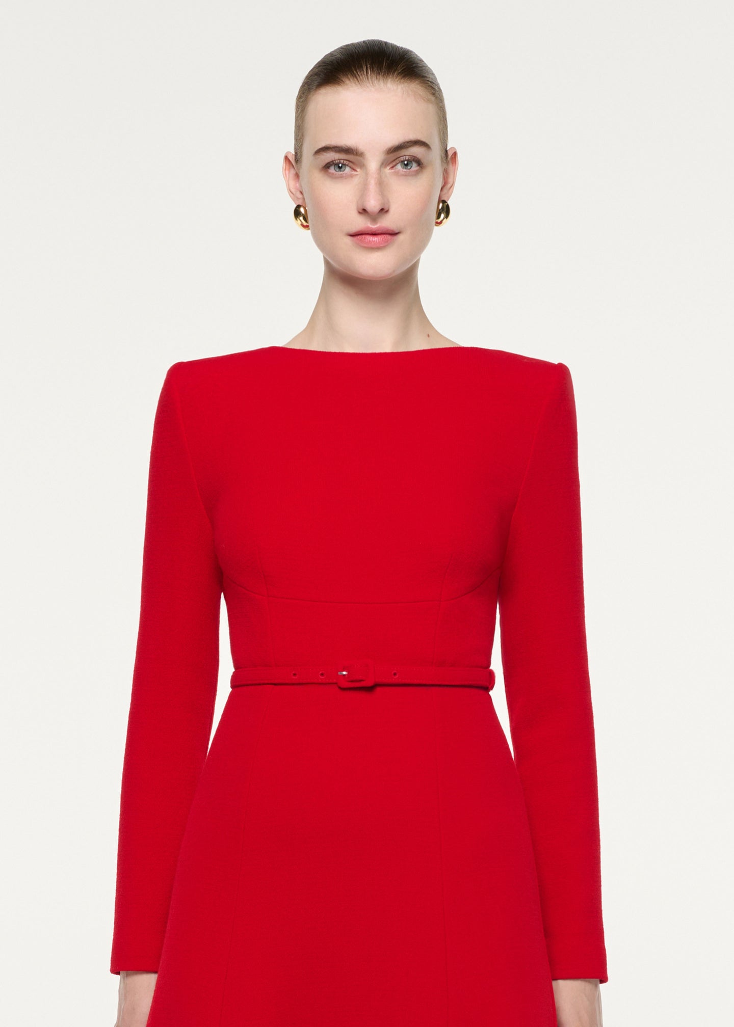 Close up of a model wearing the Boat Neck Wool Crepe Dress