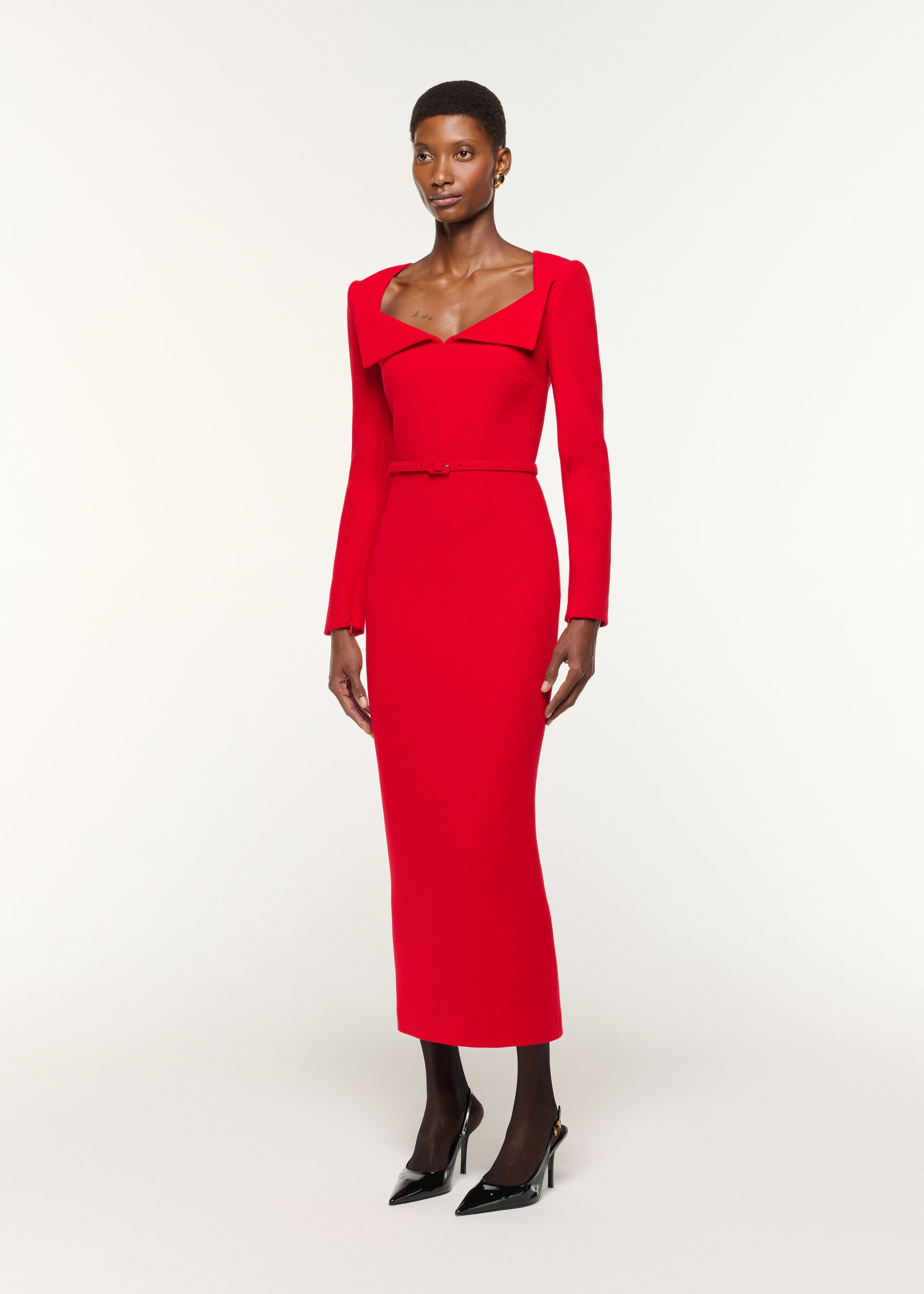 Side view of a model wearing the Square Neck Collar Fold Wool Crepe Dress in Red