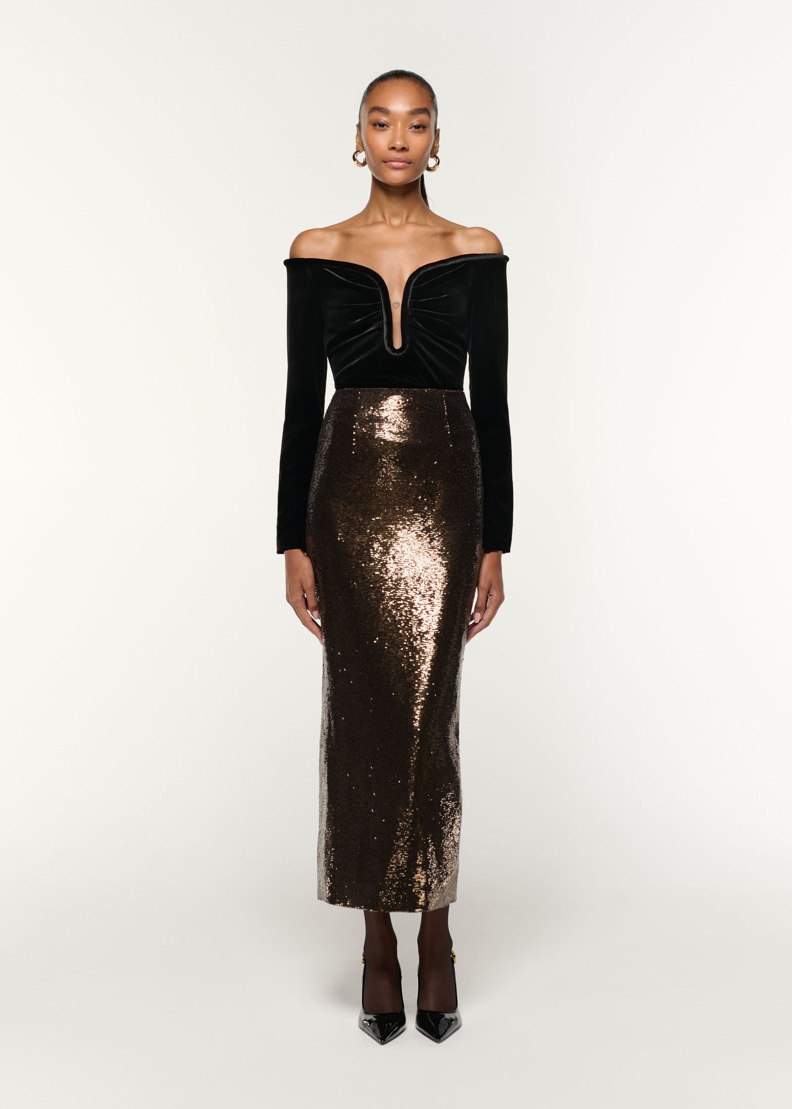 Front view of a model wearing the Plunge Neck Velvet Top in Black