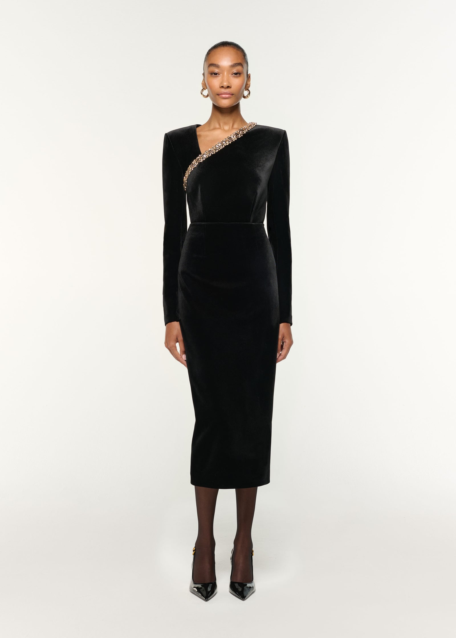 Front view of a model wearing the Long Sleeve Embellished Velvet Top in Black