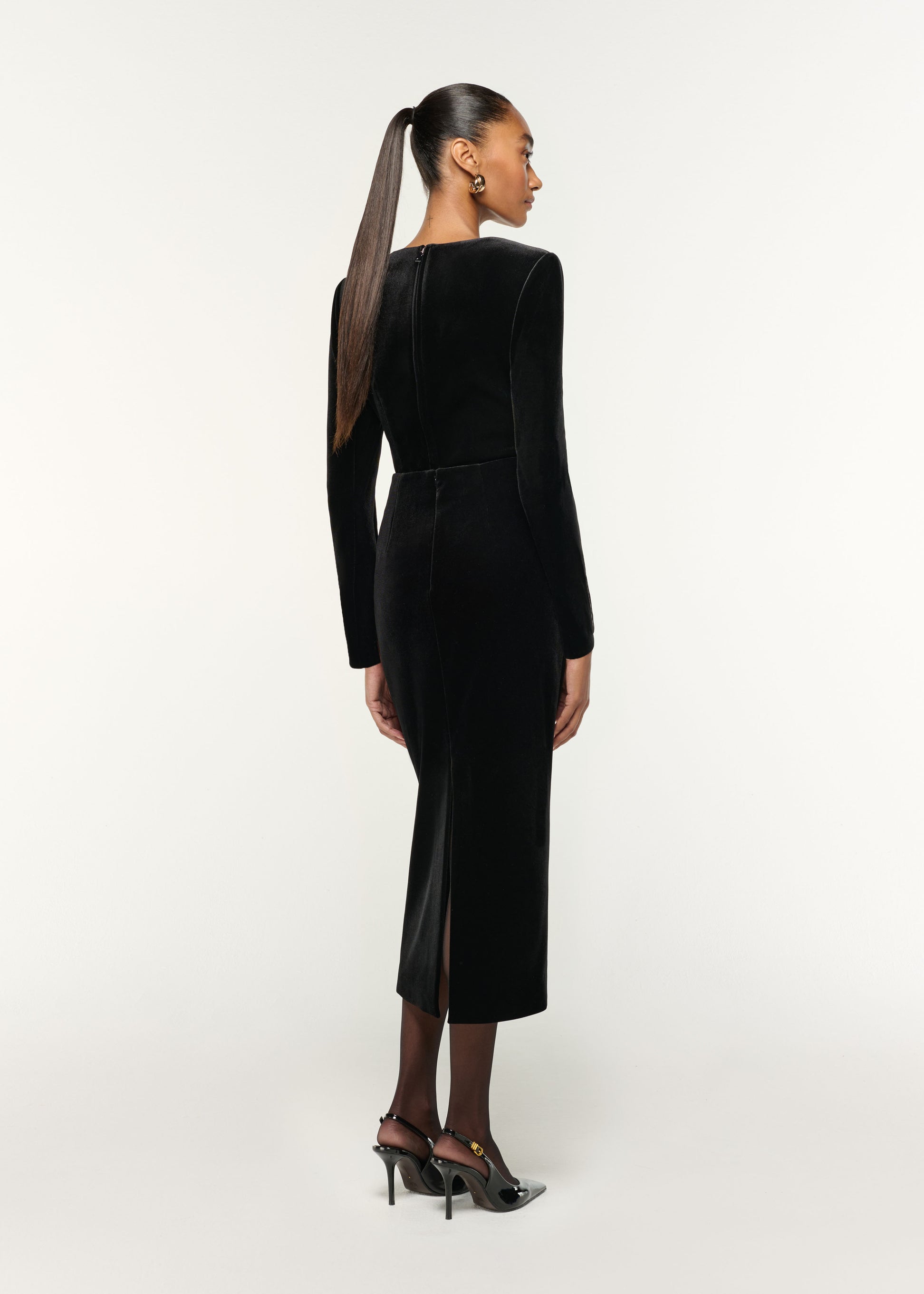 Back view of a model wearing the Long Sleeve Embellished Velvet Top in Black