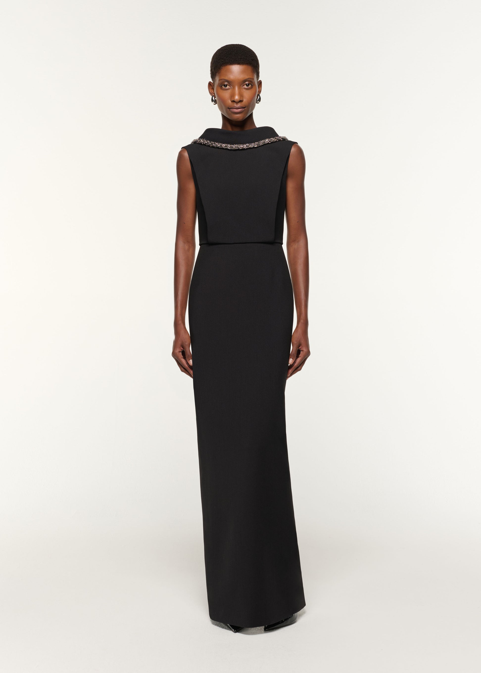 Front view of a model wearing the Diamante Roll Neck Crepe Gown in Black
