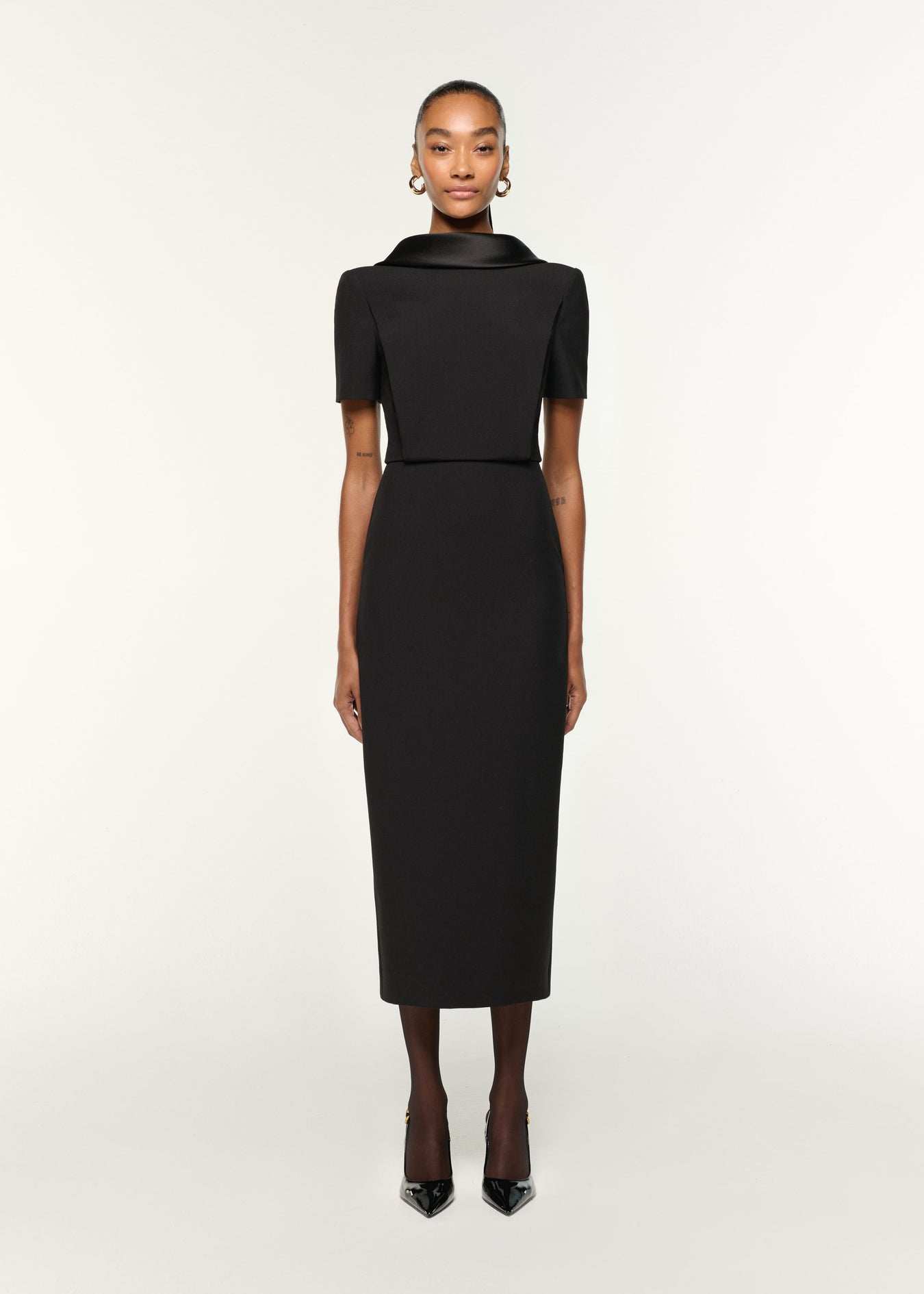 Front view of a model wearing the Collared Crepe Midi Dress in Black