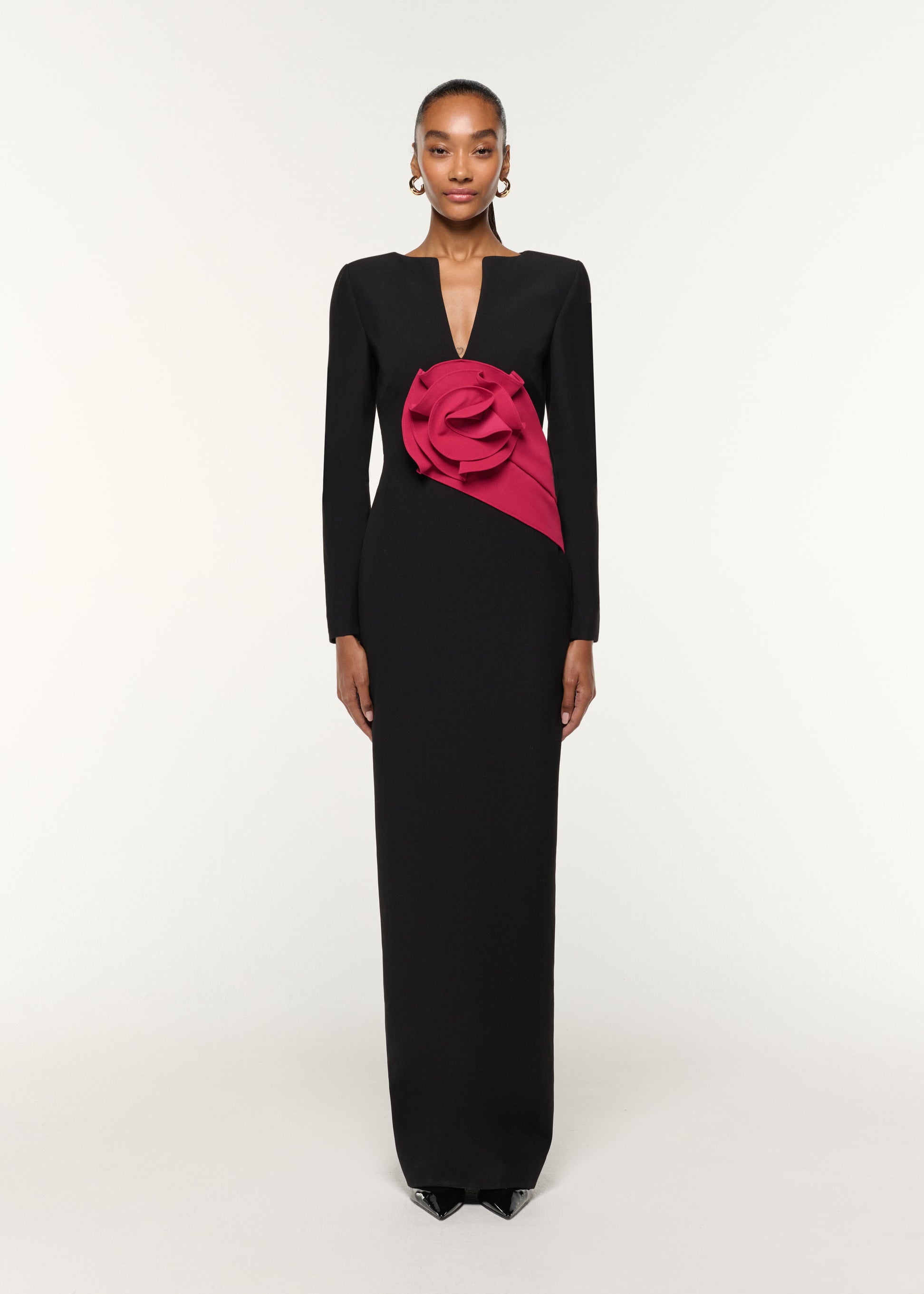 Front view of a model wearing the Flower Drape Crepe Gown in Black