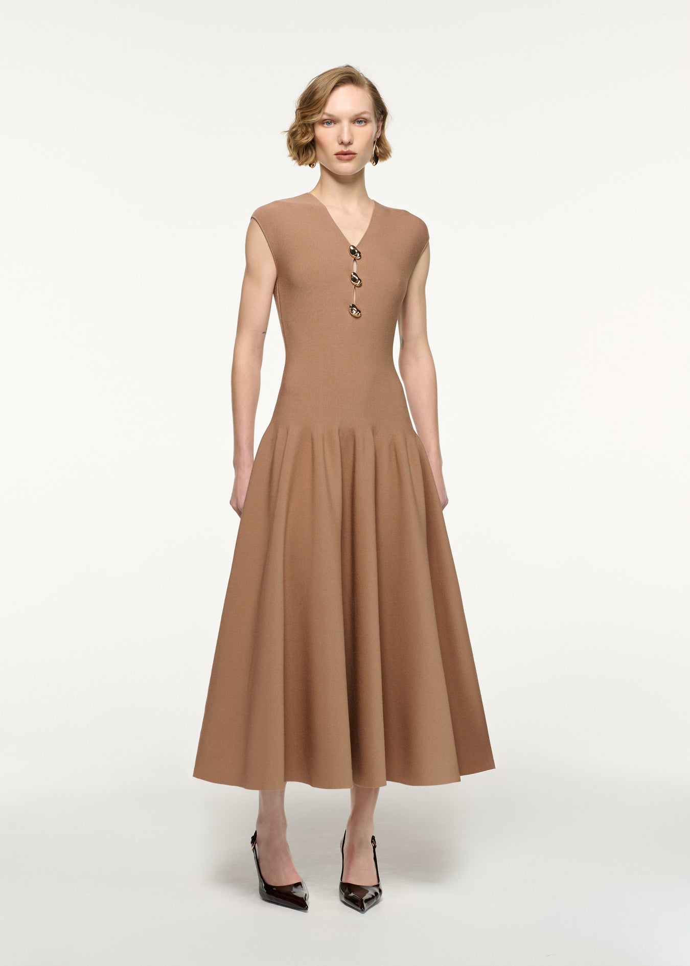 Front view of a model wearing the Pebble Trimmed Knit Dress in Camel