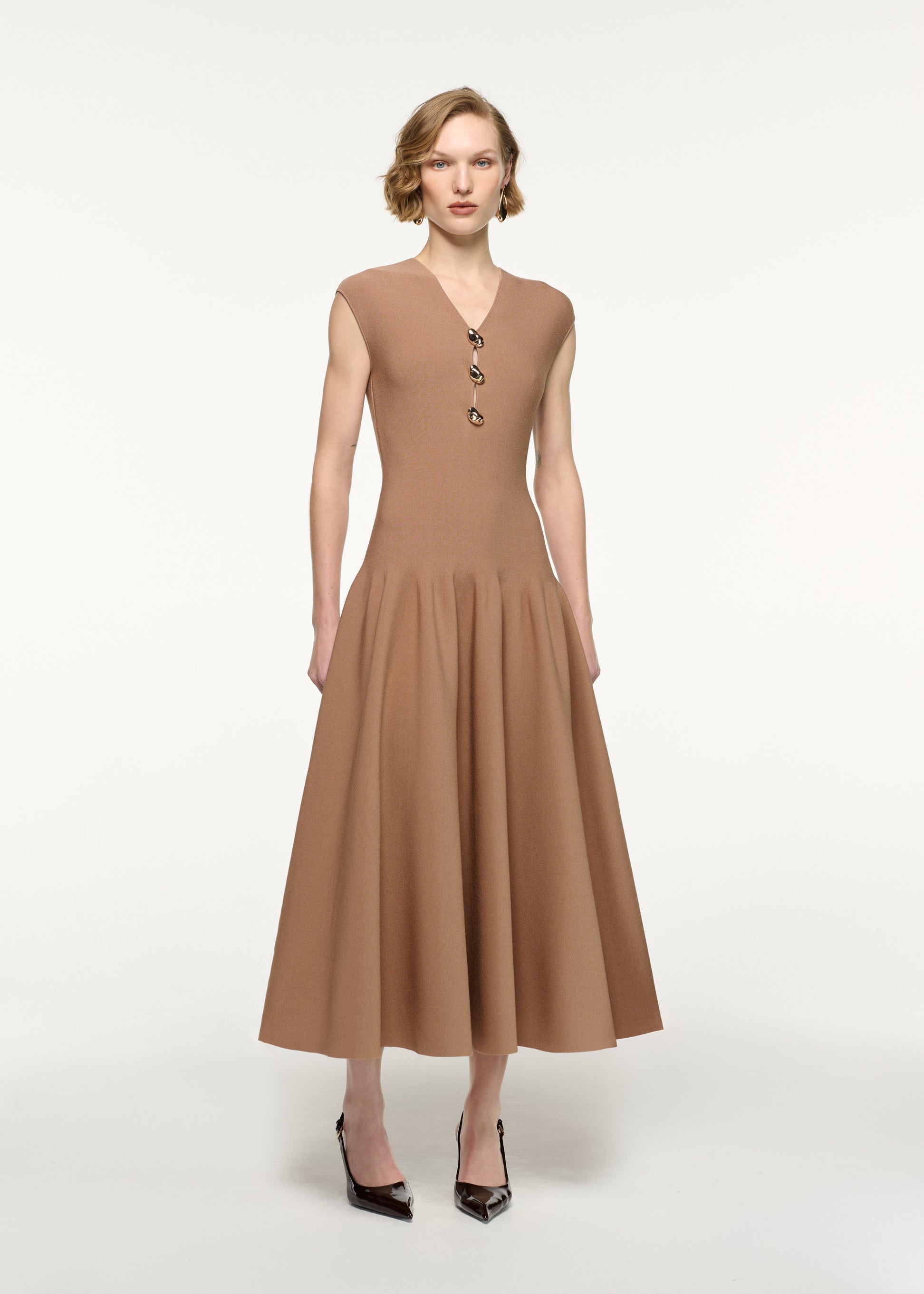 Front view of a model wearing the Pebble Trimmed Knit Dress in Camel