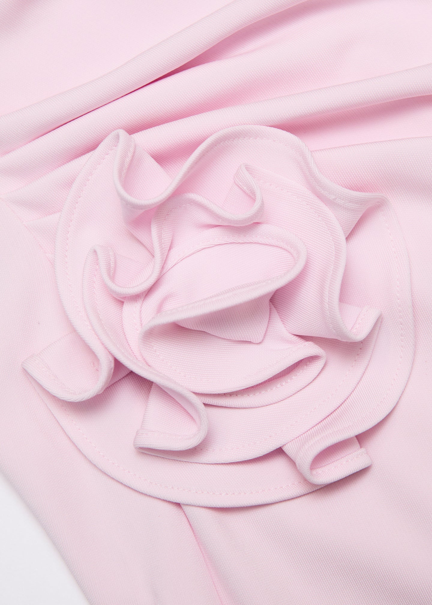 A close up of the fabric for the Off The Shoulder Flower Jersey Dress in Pink