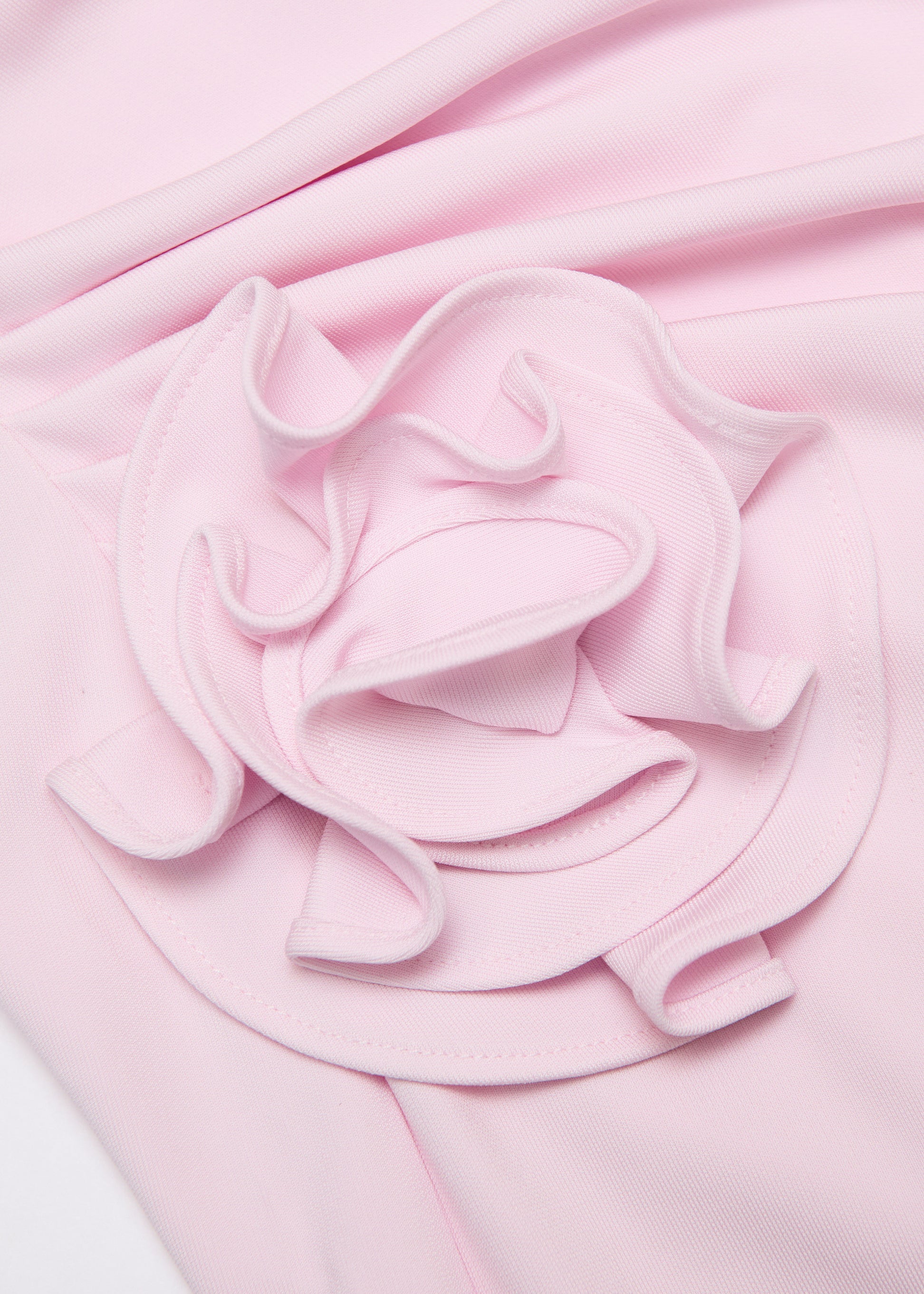 A close up of the fabric for the Off The Shoulder Flower Jersey Dress in Pink