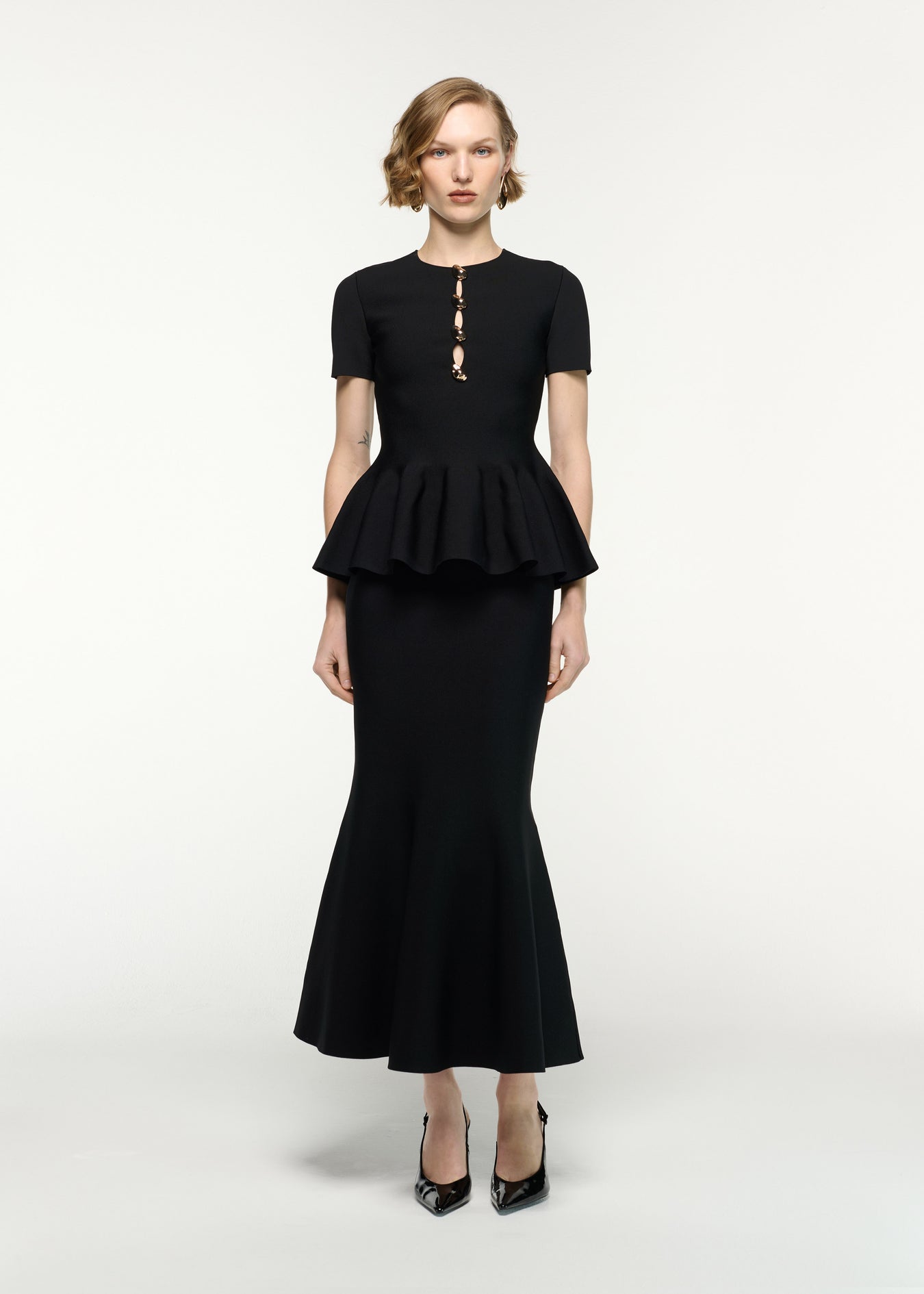 Front view of a model wearing the Mermaid Knit Midi Skirt in Black 