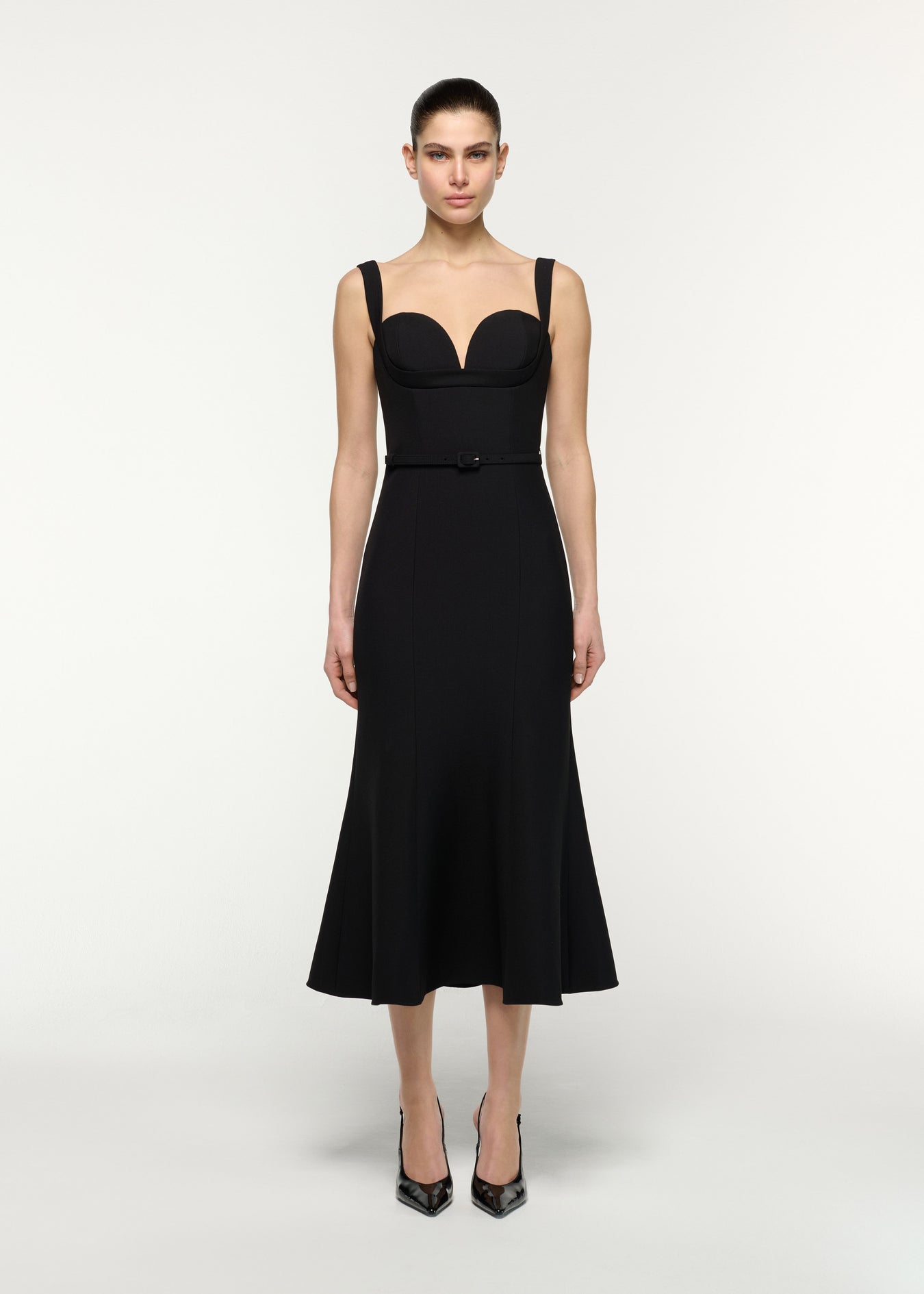Front view of a model wearing the Belted Fit And Flare Midi Dress in Black 