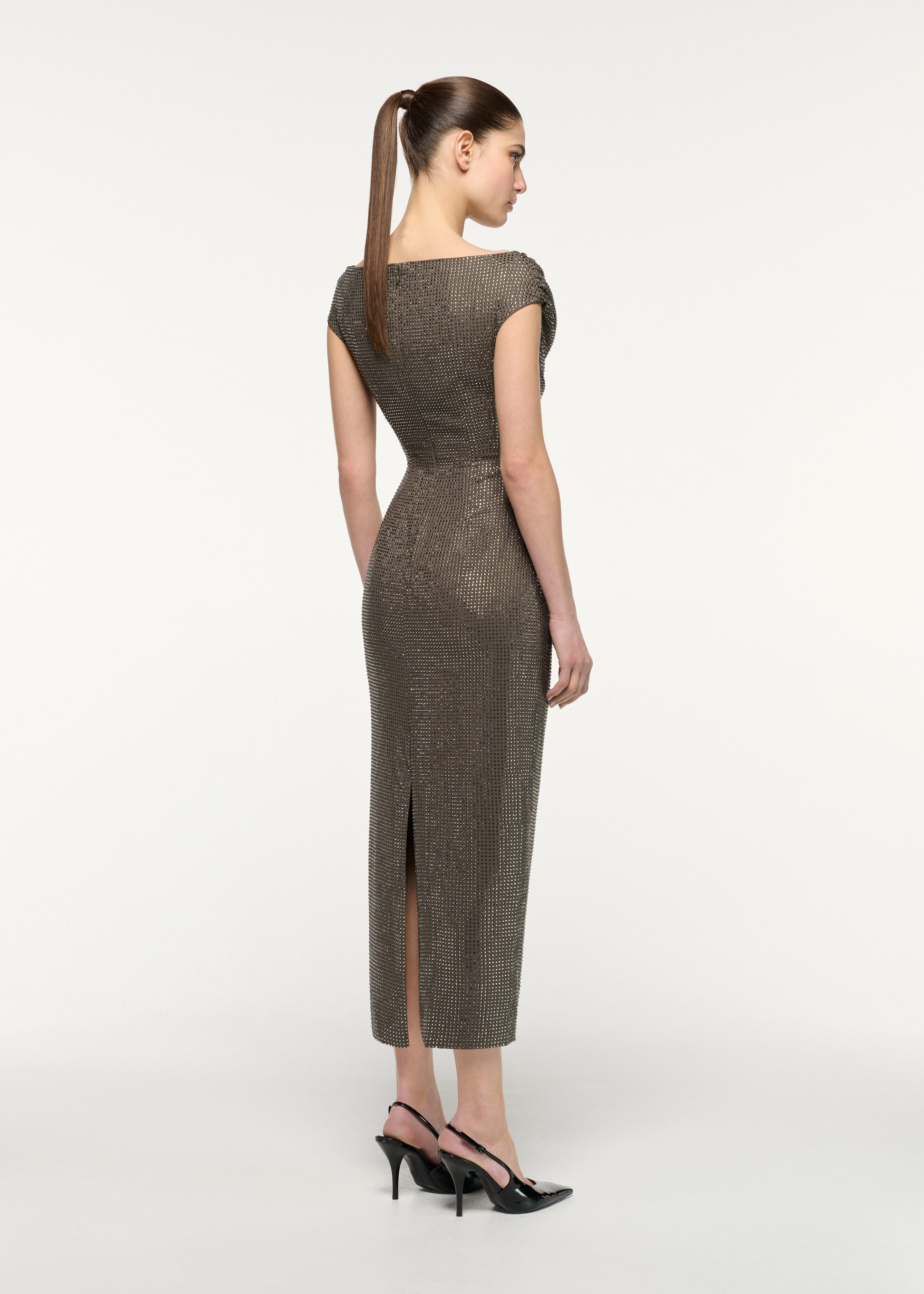 Back view of a model wearing the Gold Rose Brooched Diamante Midi Dress in Taupe