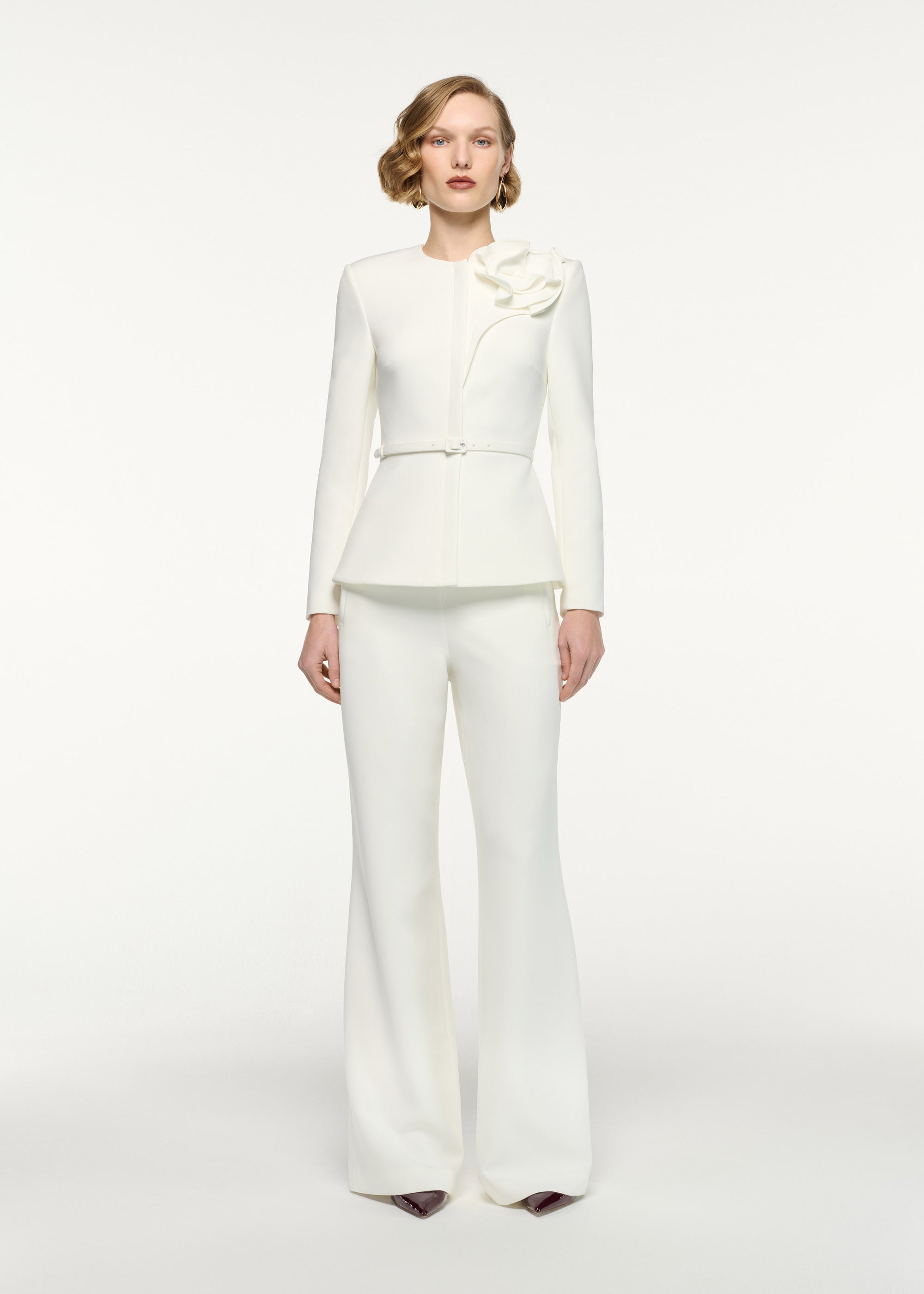 Front view of a model wearing the Straight Leg Crepe Trousers in Cream 