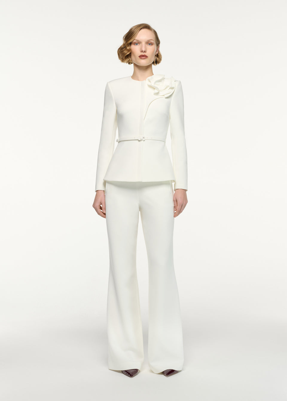 Front view of a model wearing the Straight Leg Crepe Trousers in Cream 