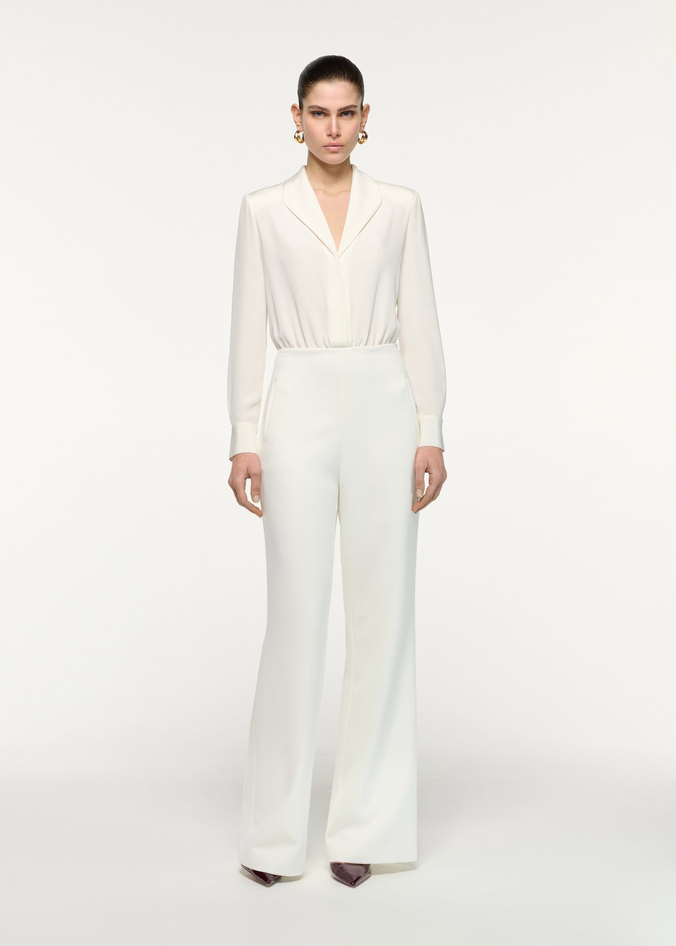 Front view of a model wearing the Silk Shirt Bodysuit in Cream 