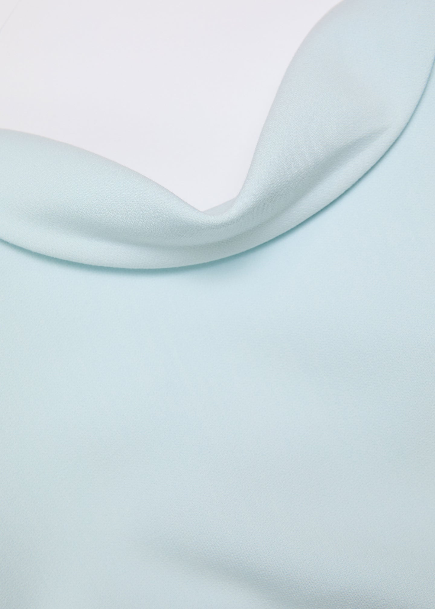 A close up of the fabric for the Collared Crepe Column Midi Dress in Aqua