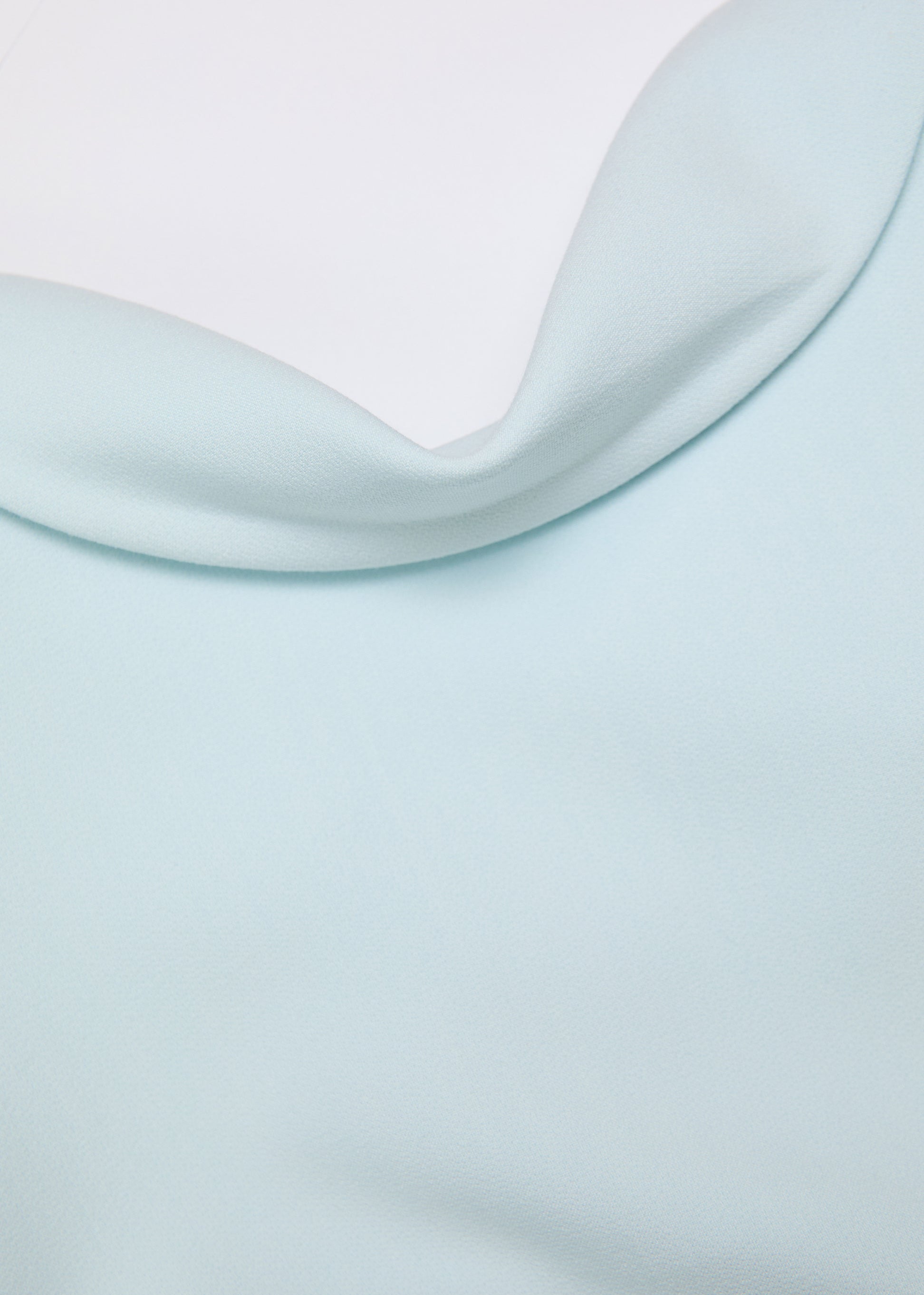 A close up of the fabric for the Collared Crepe Column Midi Dress in Aqua