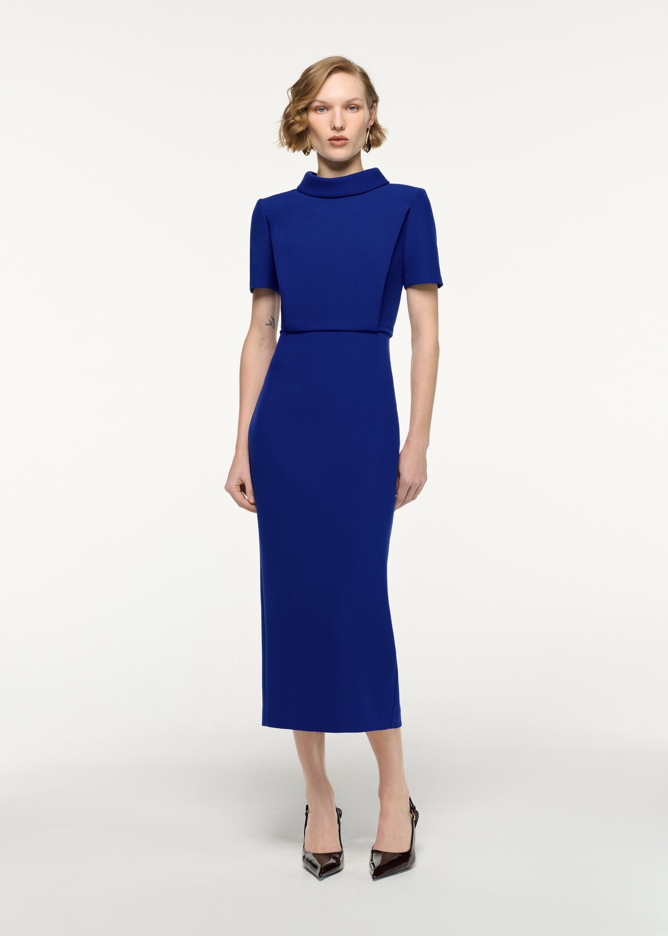 Front view of a model wearing the Collared Crepe Column Midi Dress in Blue